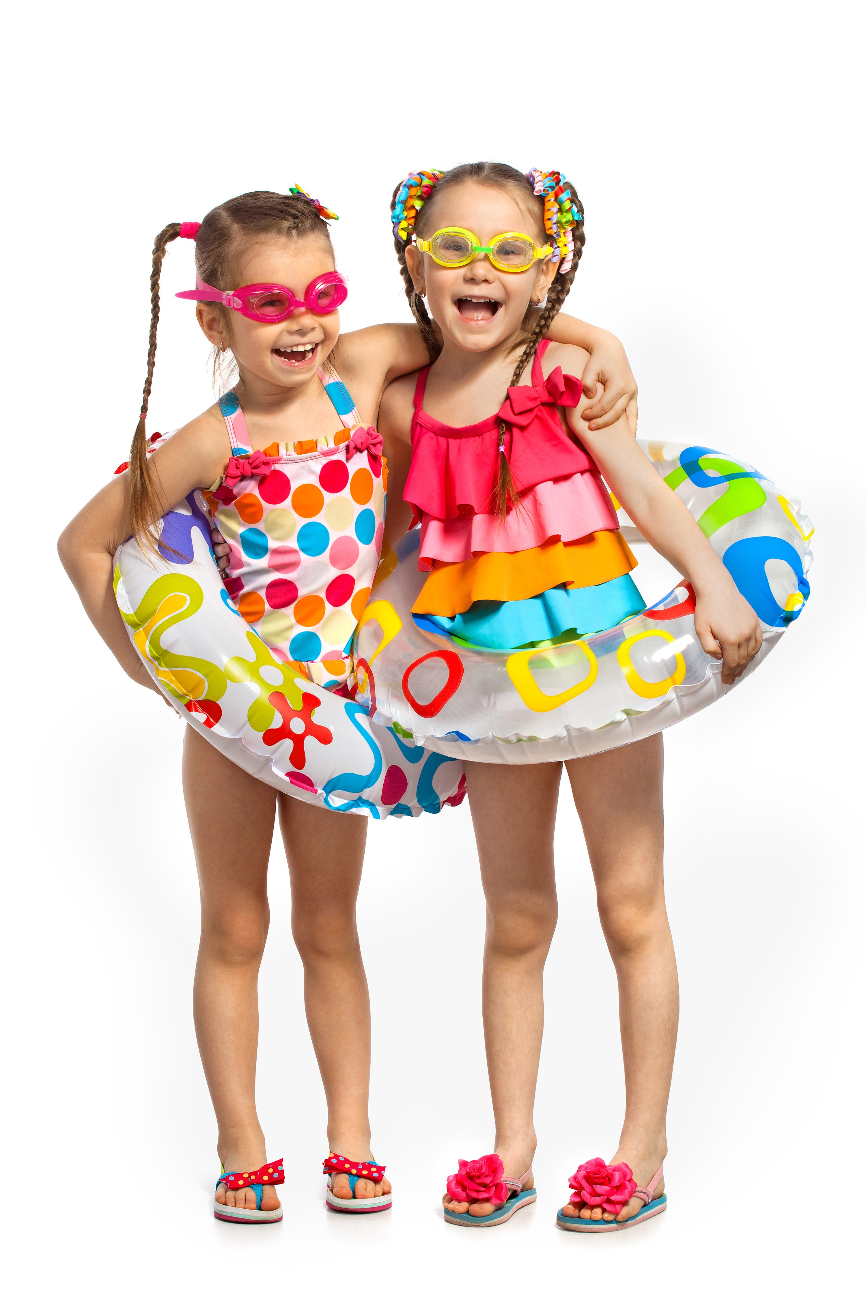 Two smiling girls in swimsuits and goggles with inflatable rings HD Phone Wallpaper