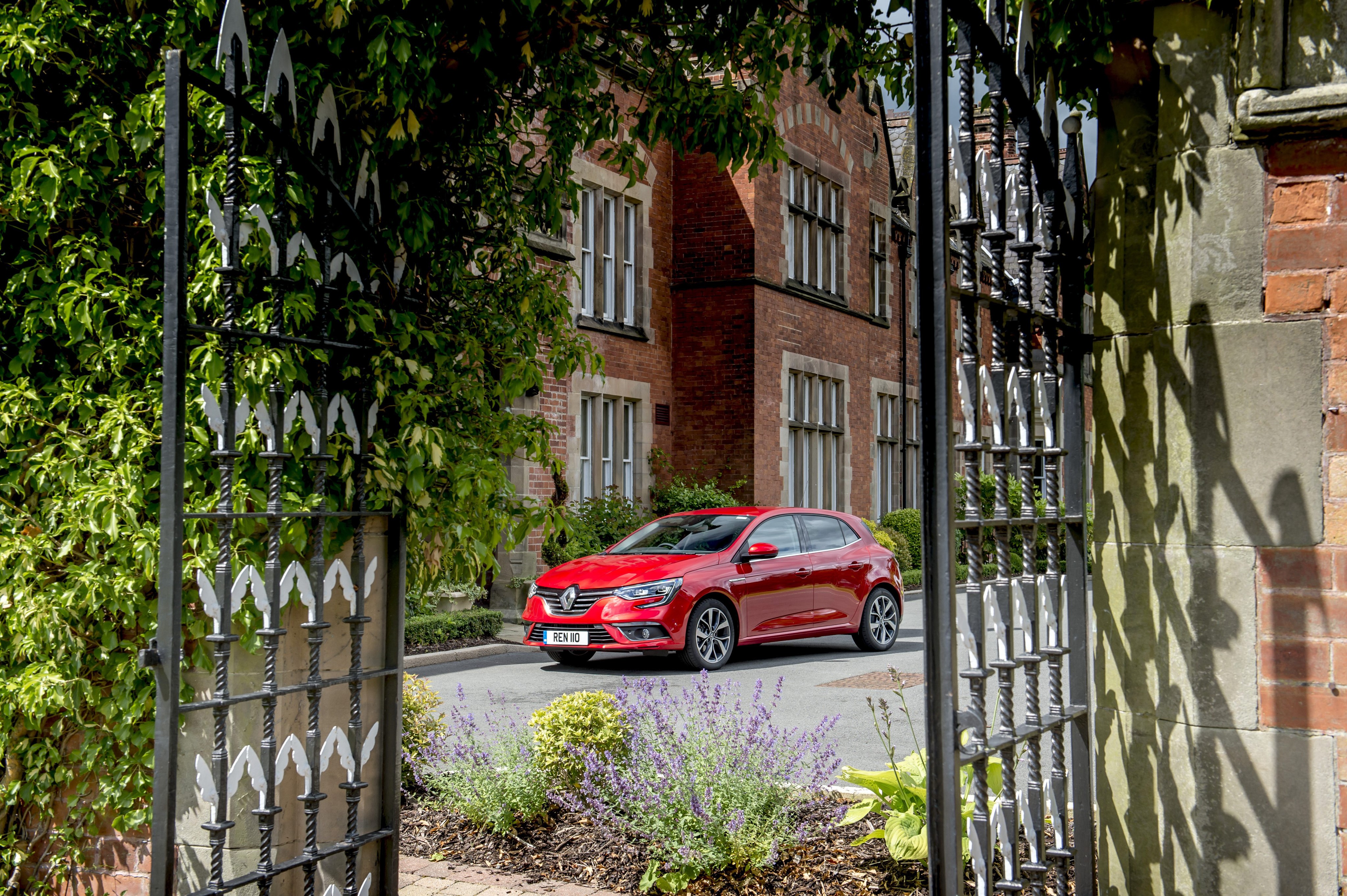 Red Renault Megane GT Line parked outside building HD Wallpaper