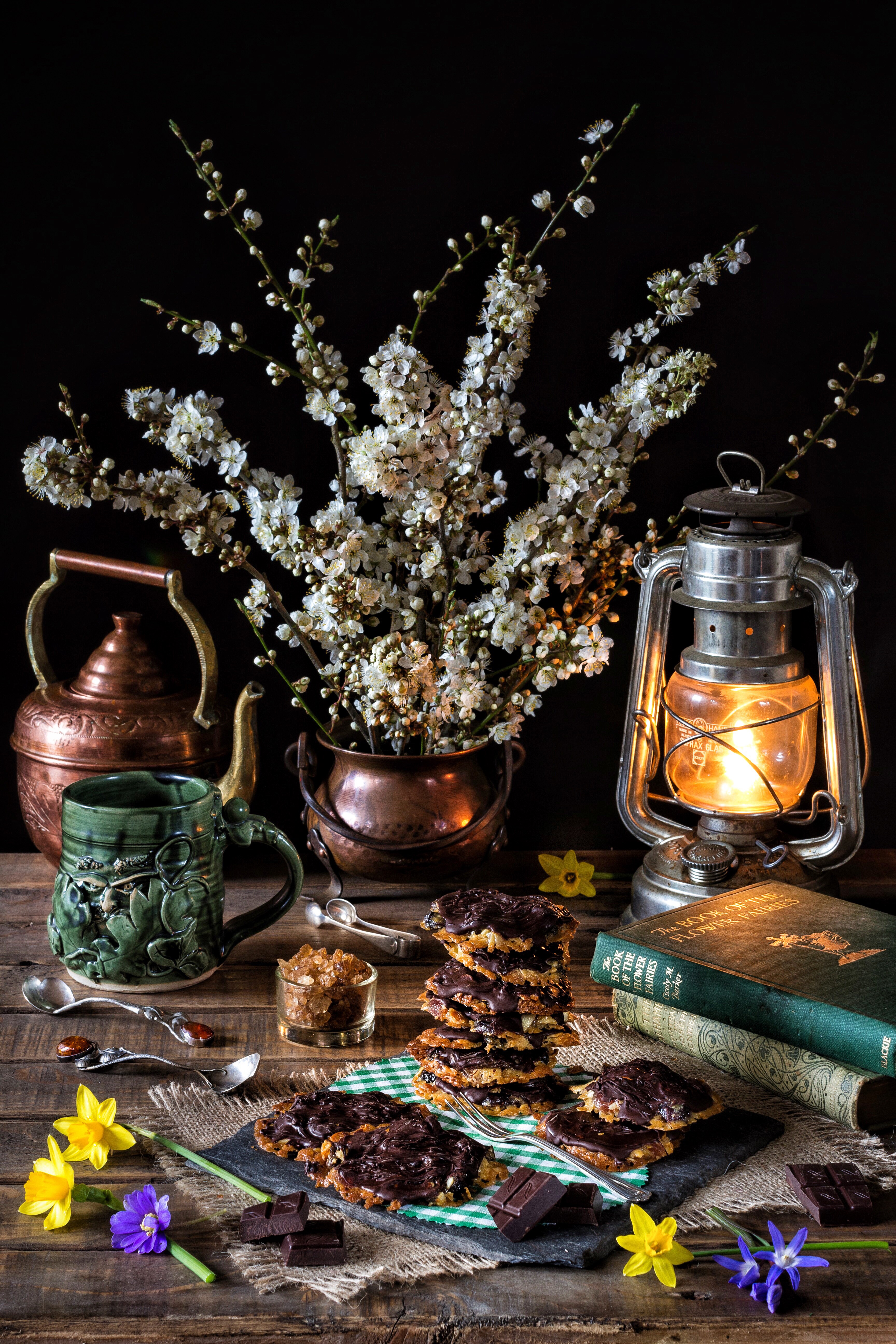 Still life with cookies, flowers, and lantern HD Phone Wallpaper