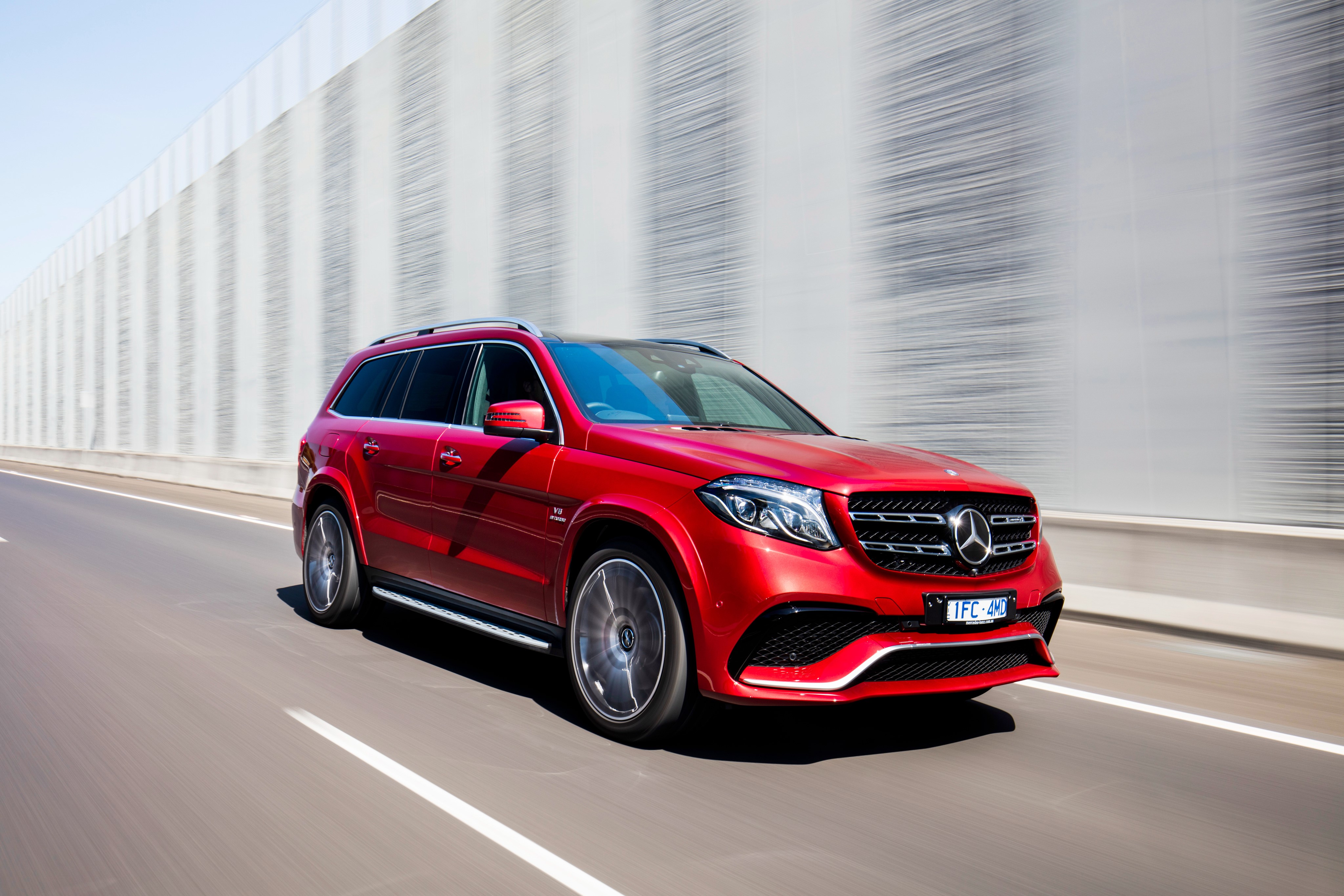 Red Mercedes-Benz AMG X166 GLS-Class on a highway HD Wallpaper