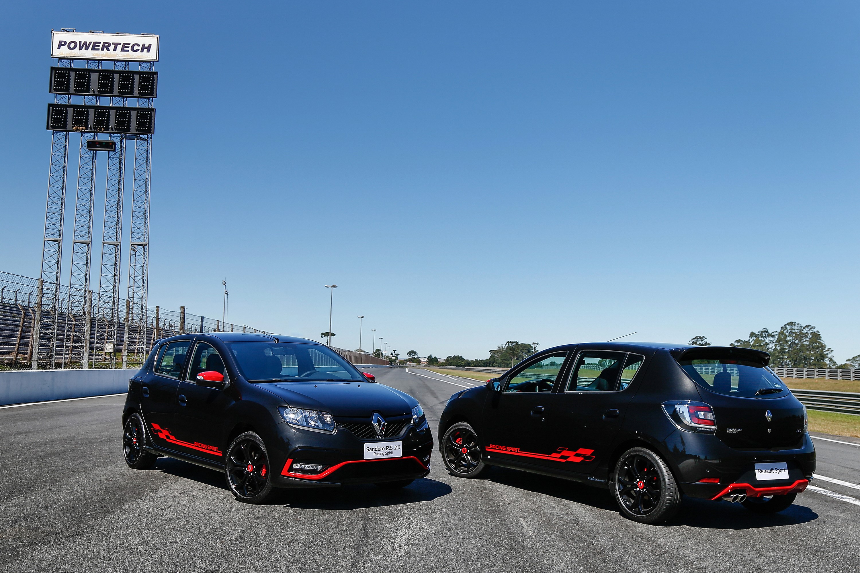 Two black Renault Sandero R.S. 2.0 Racing Spirit cars on a racetrack HD Wallpaper