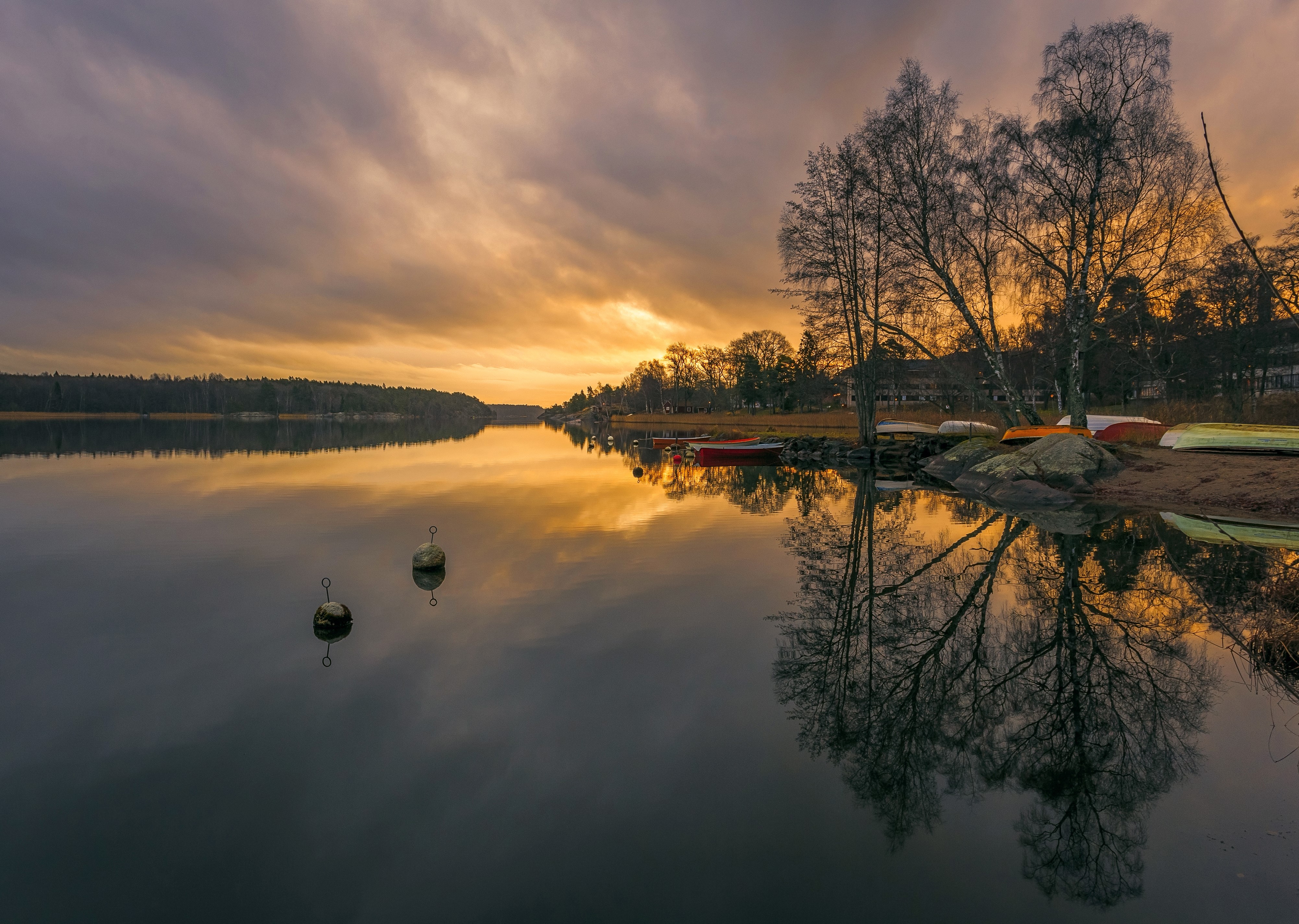 Sunset over a lake in Sweden with boats HD Wallpaper
