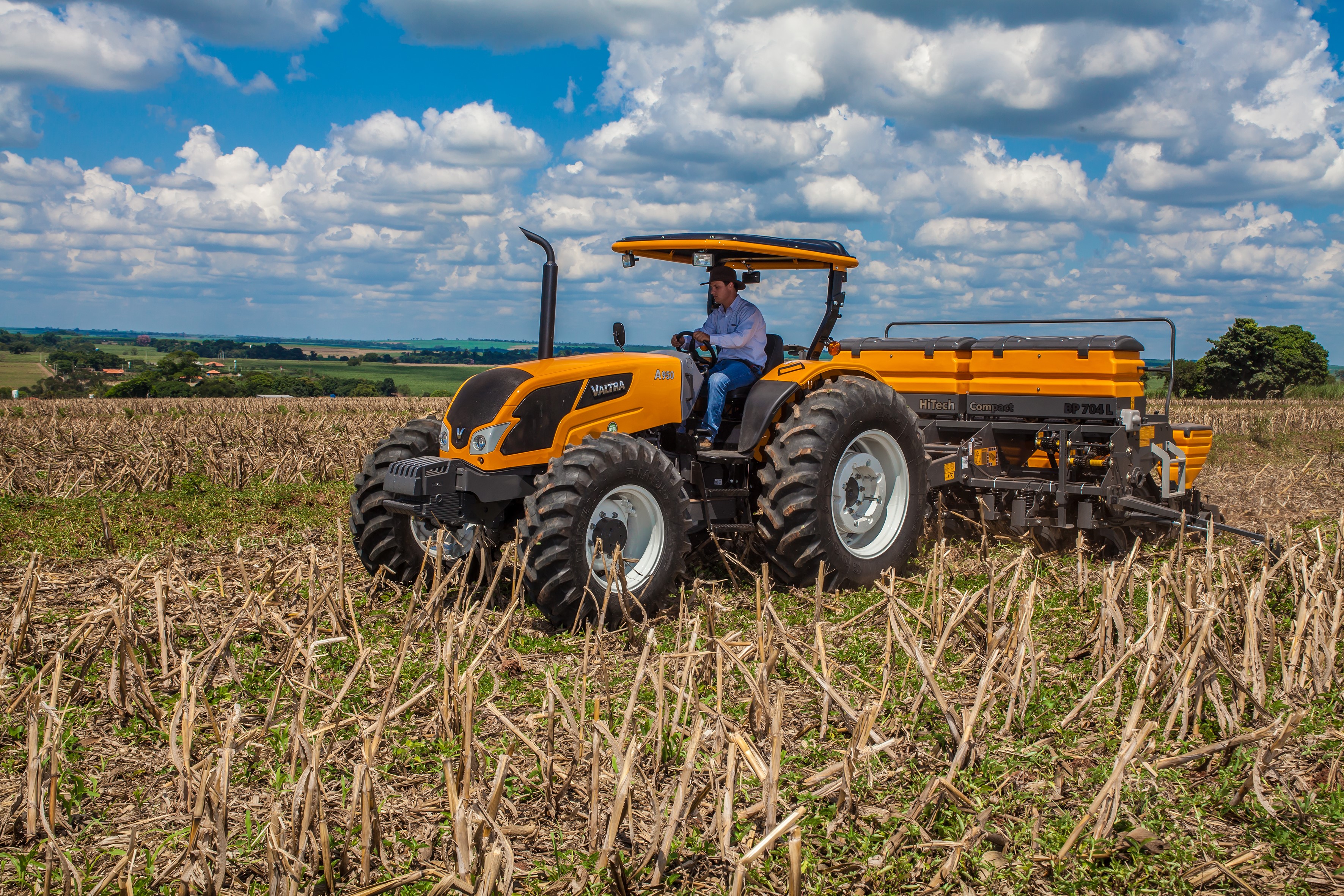 Valtra A950 tractor operating in a harvested field HD Wallpaper