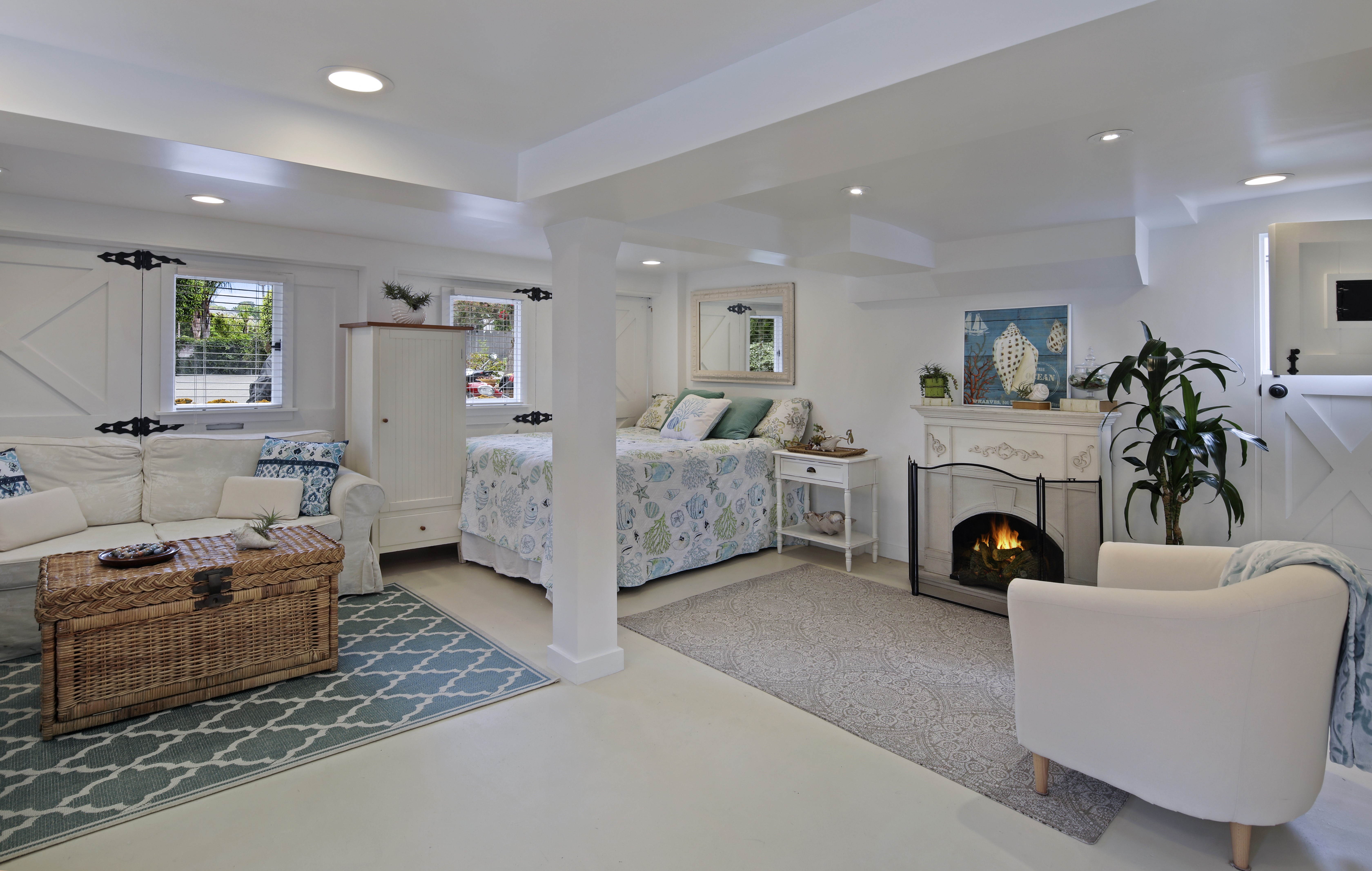 Interior design of a living room with a bed and fireplace HD Wallpaper