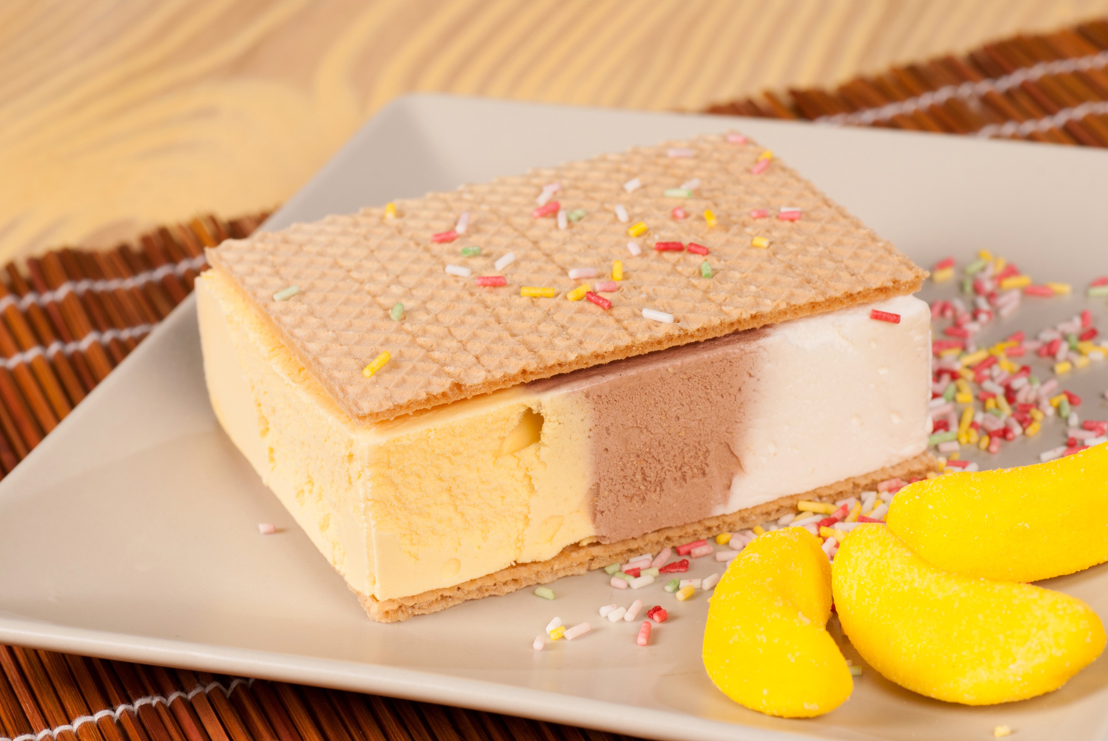 Ice cream sandwich with sprinkles and candy bananas HD Wallpaper