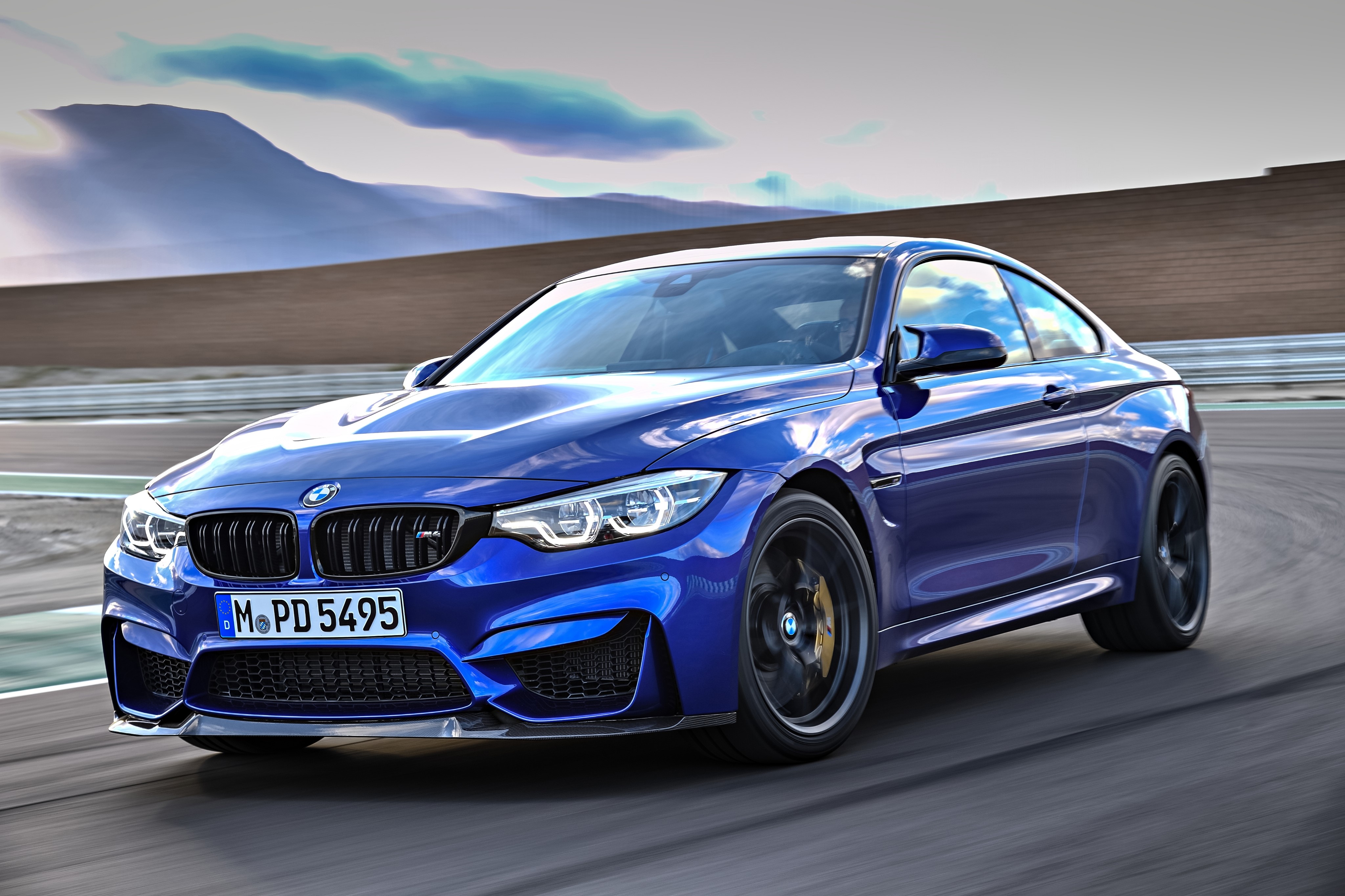 Blue BMW M4 CS on a Racetrack HD Wallpaper