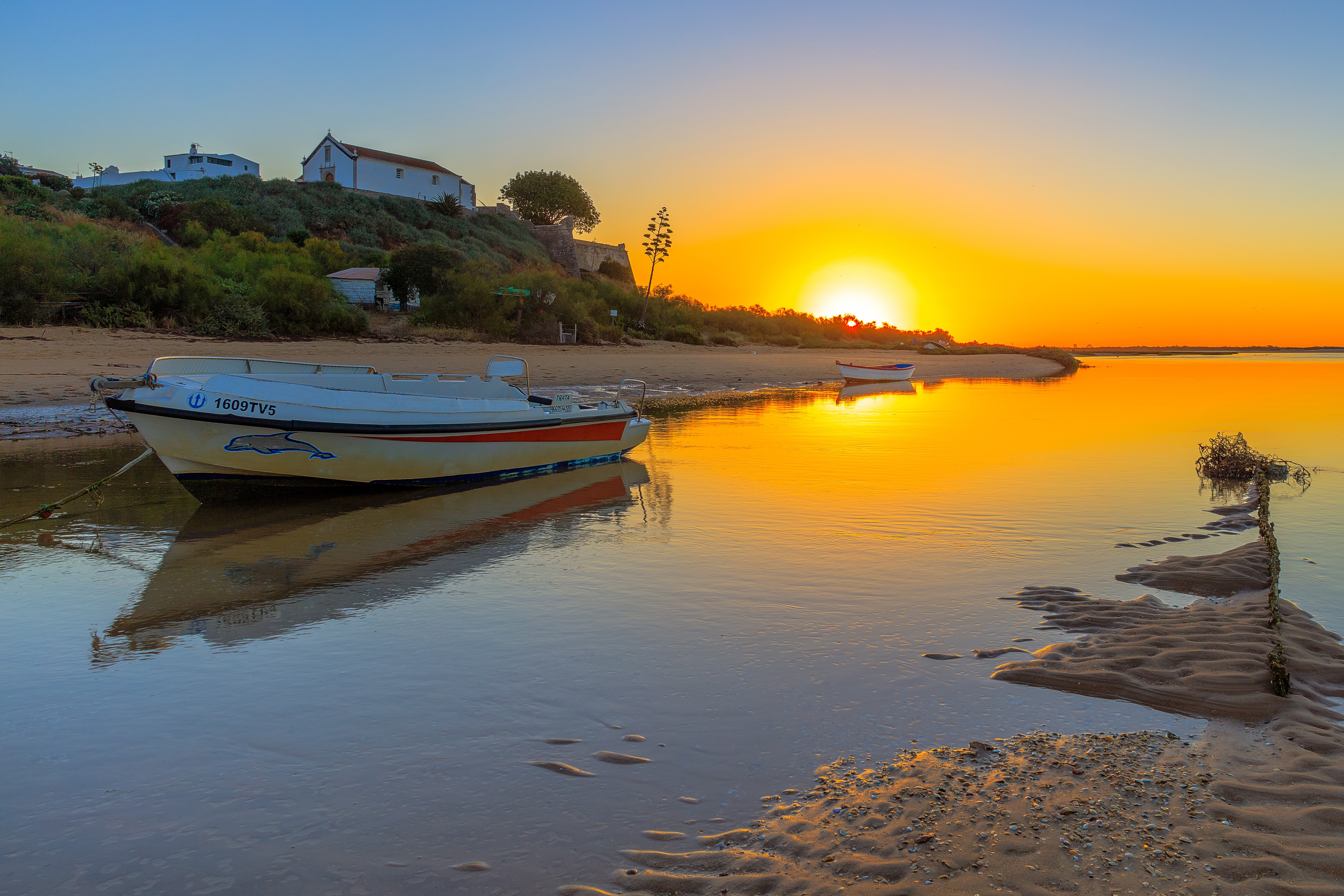 Boats on a river at sunset HD Wallpaper