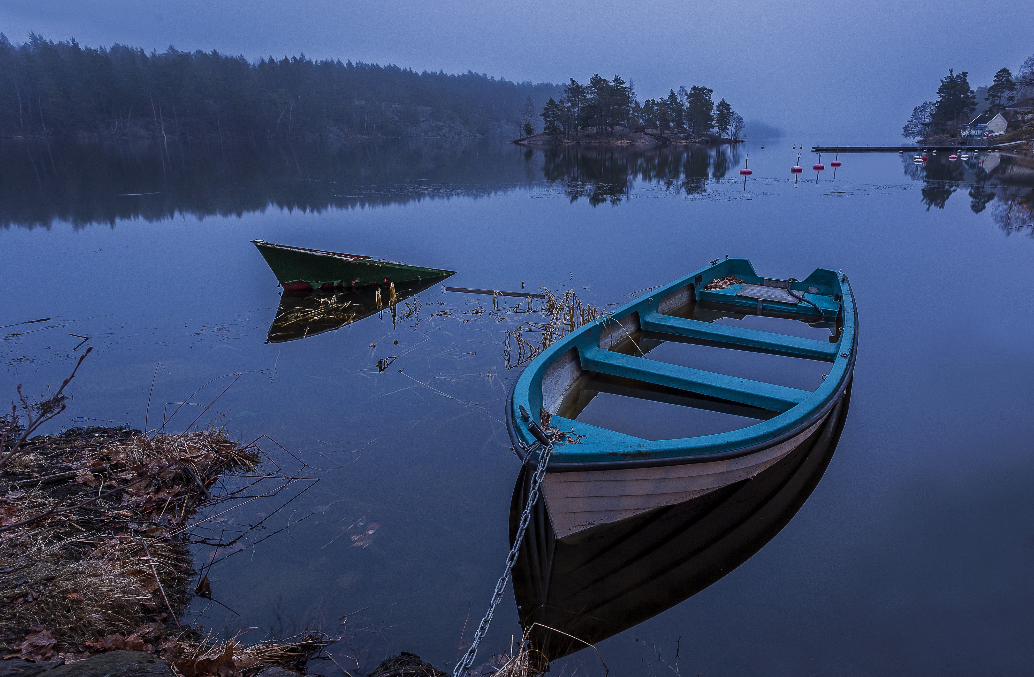 Two sunken boats on a foggy lake in Sweden HD Wallpaper