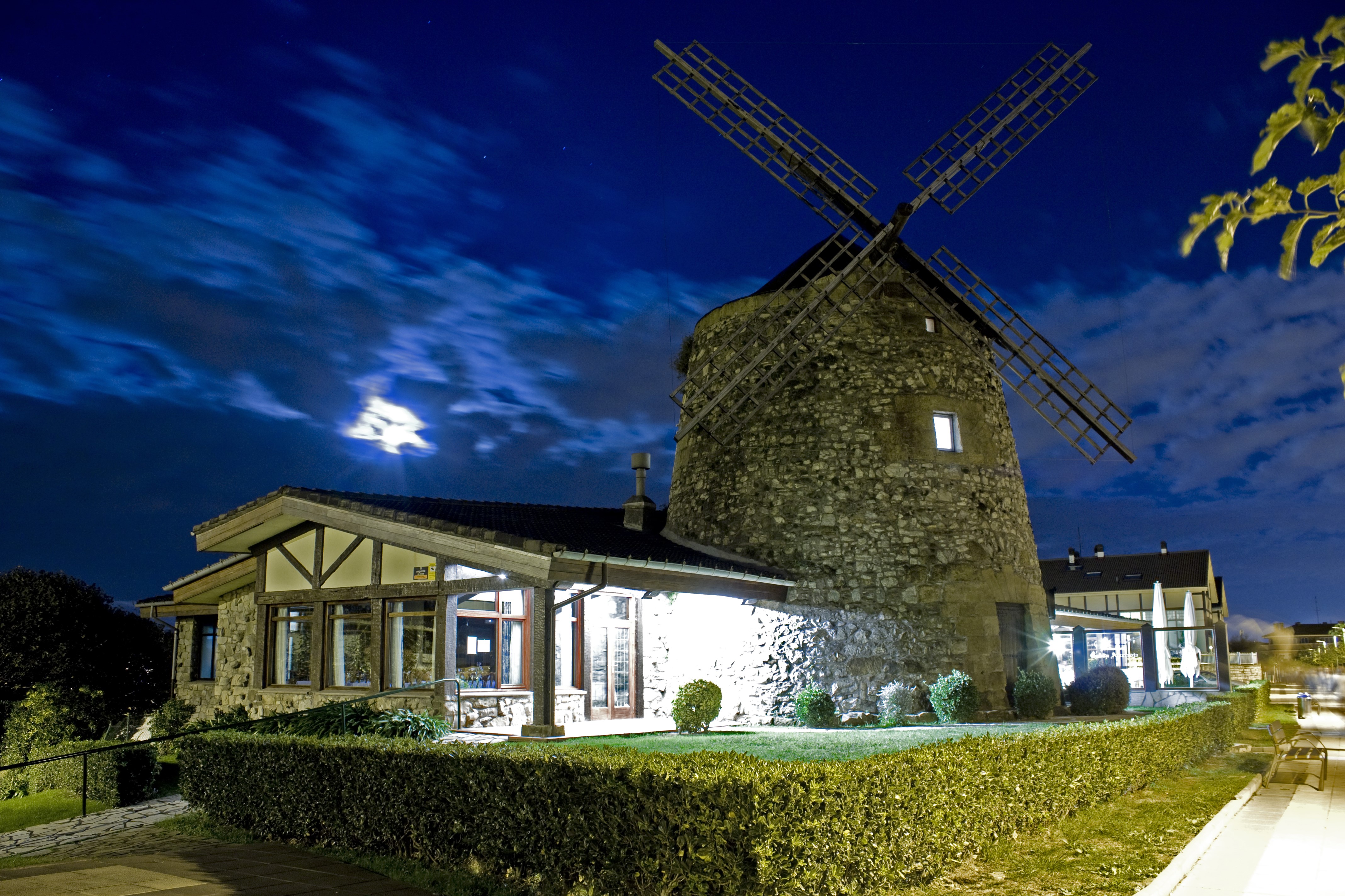 Windmill and building at night in Algorta, Basque Country, Spain HD Wallpaper