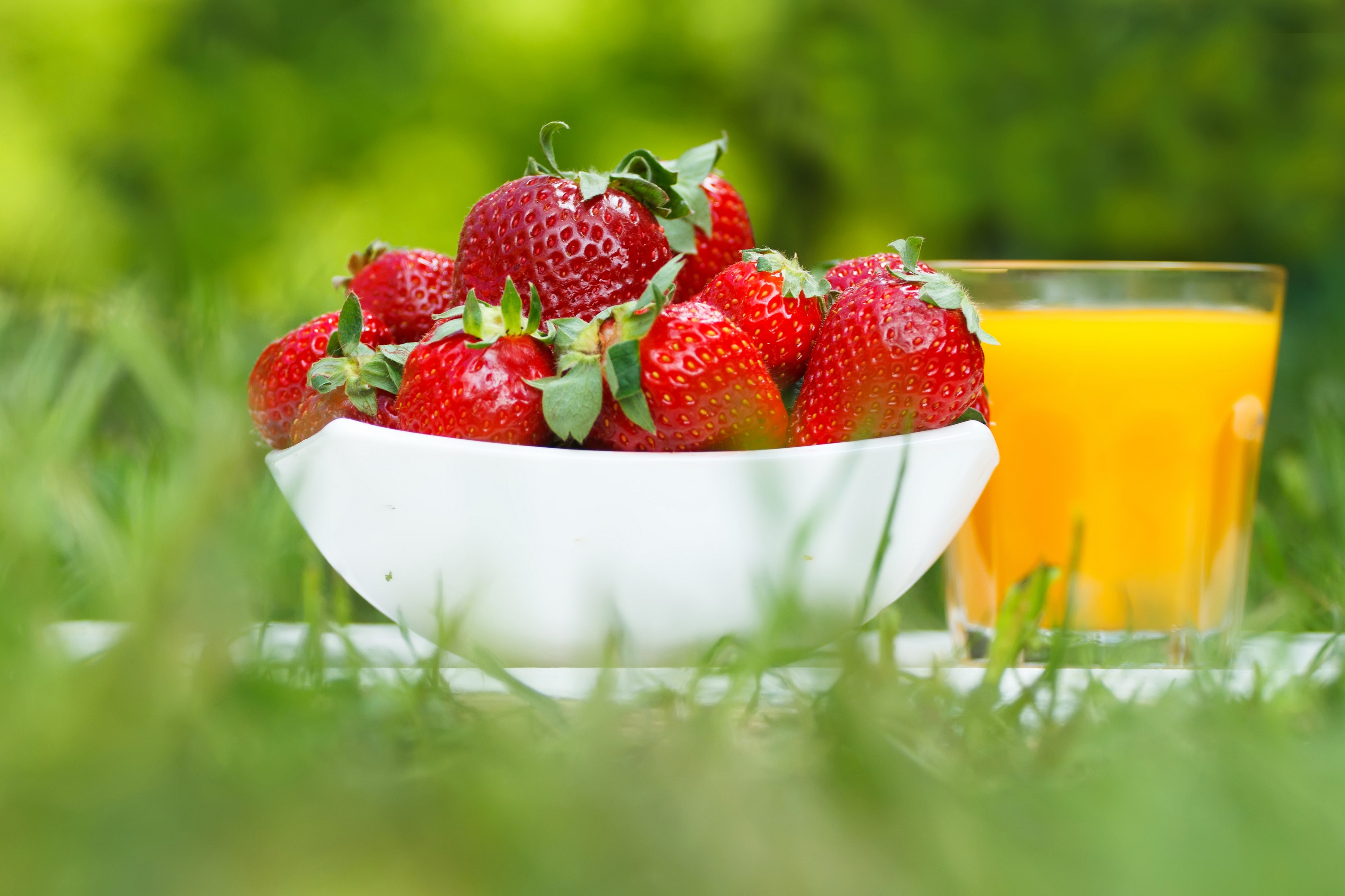 Strawberries and Juice in Grass HD Wallpaper