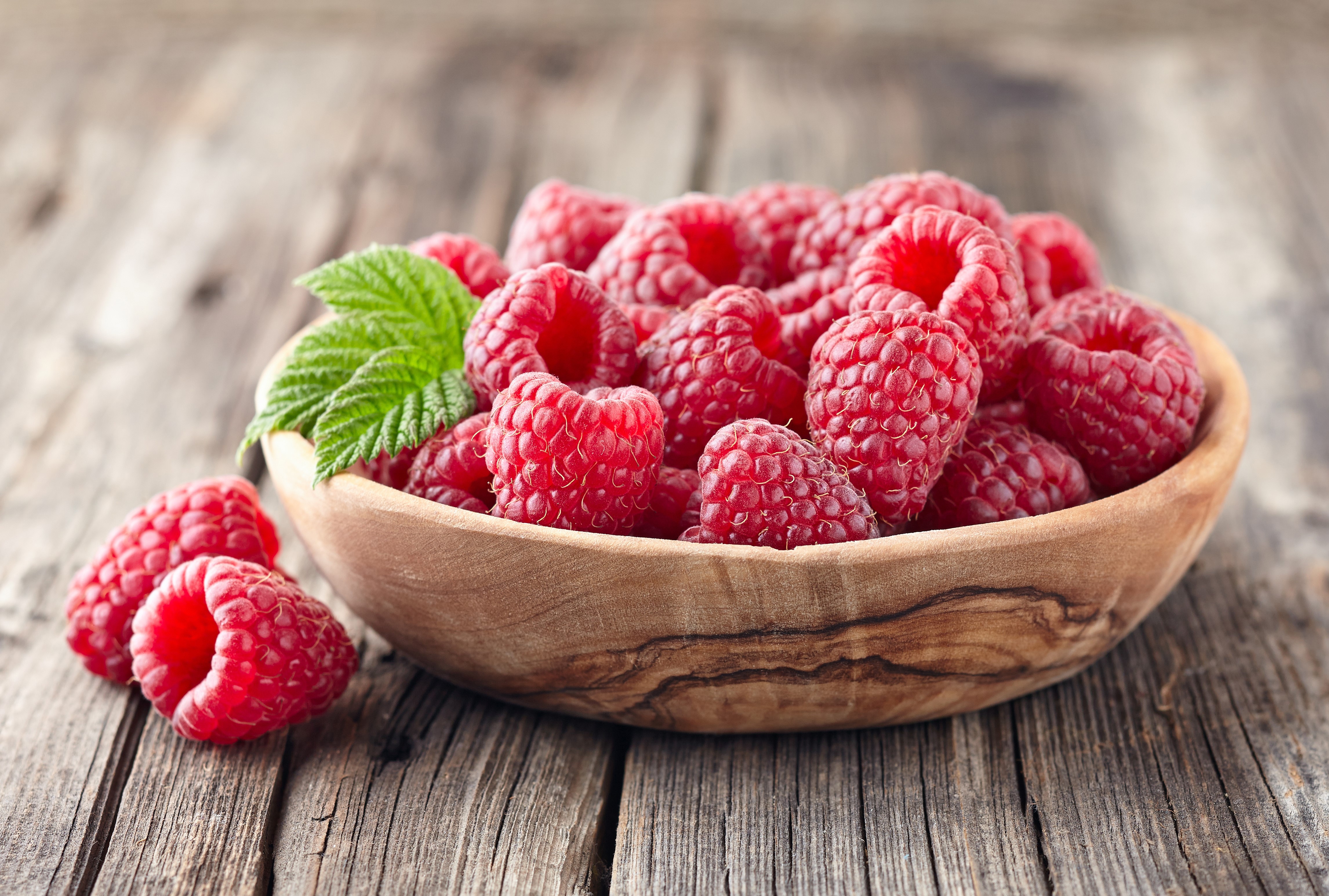 Raspberries in a Wooden Bowl on Wood Planks HD Wallpaper