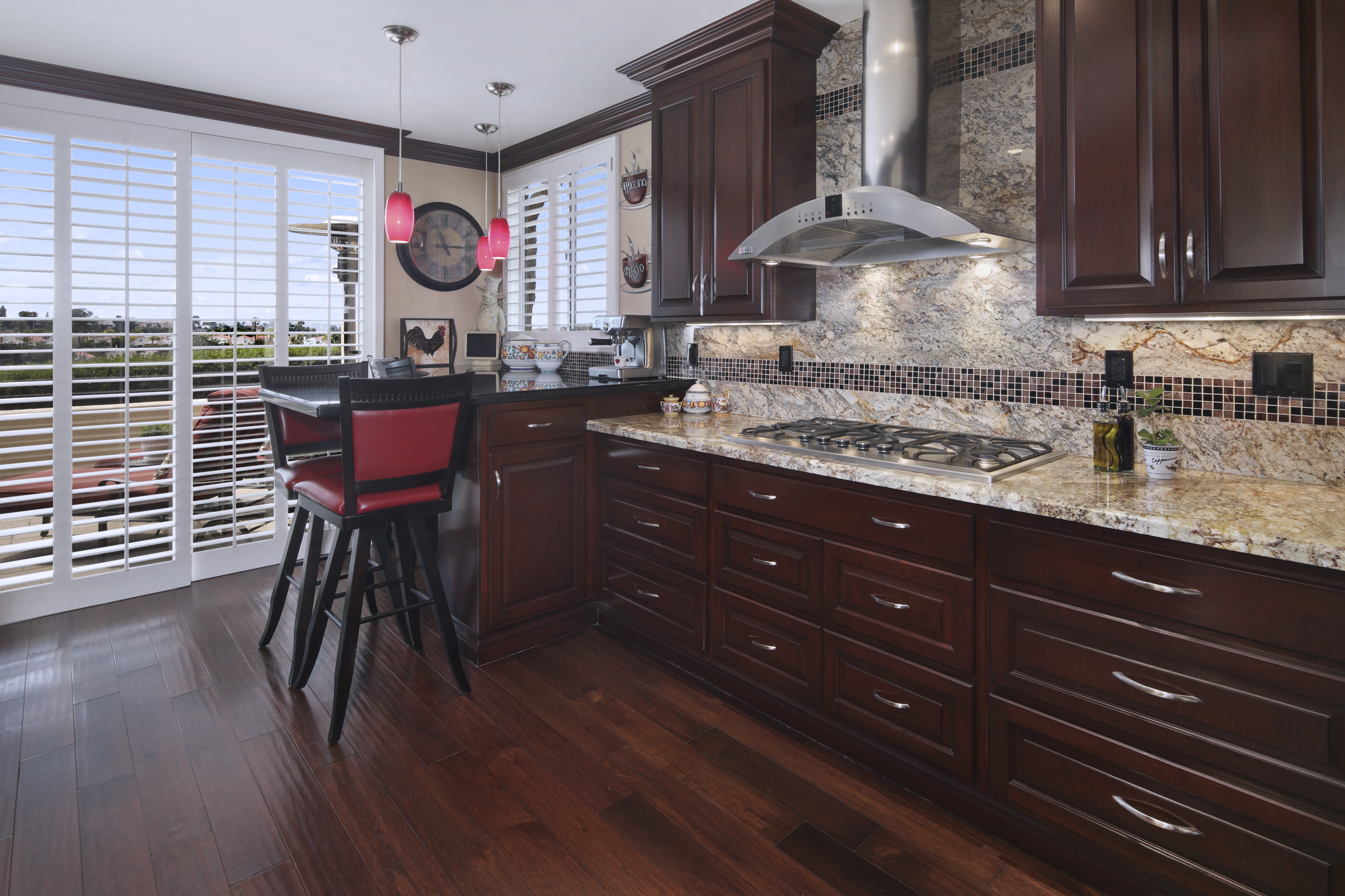 Kitchen with dark wood cabinets and island seating HD Wallpaper