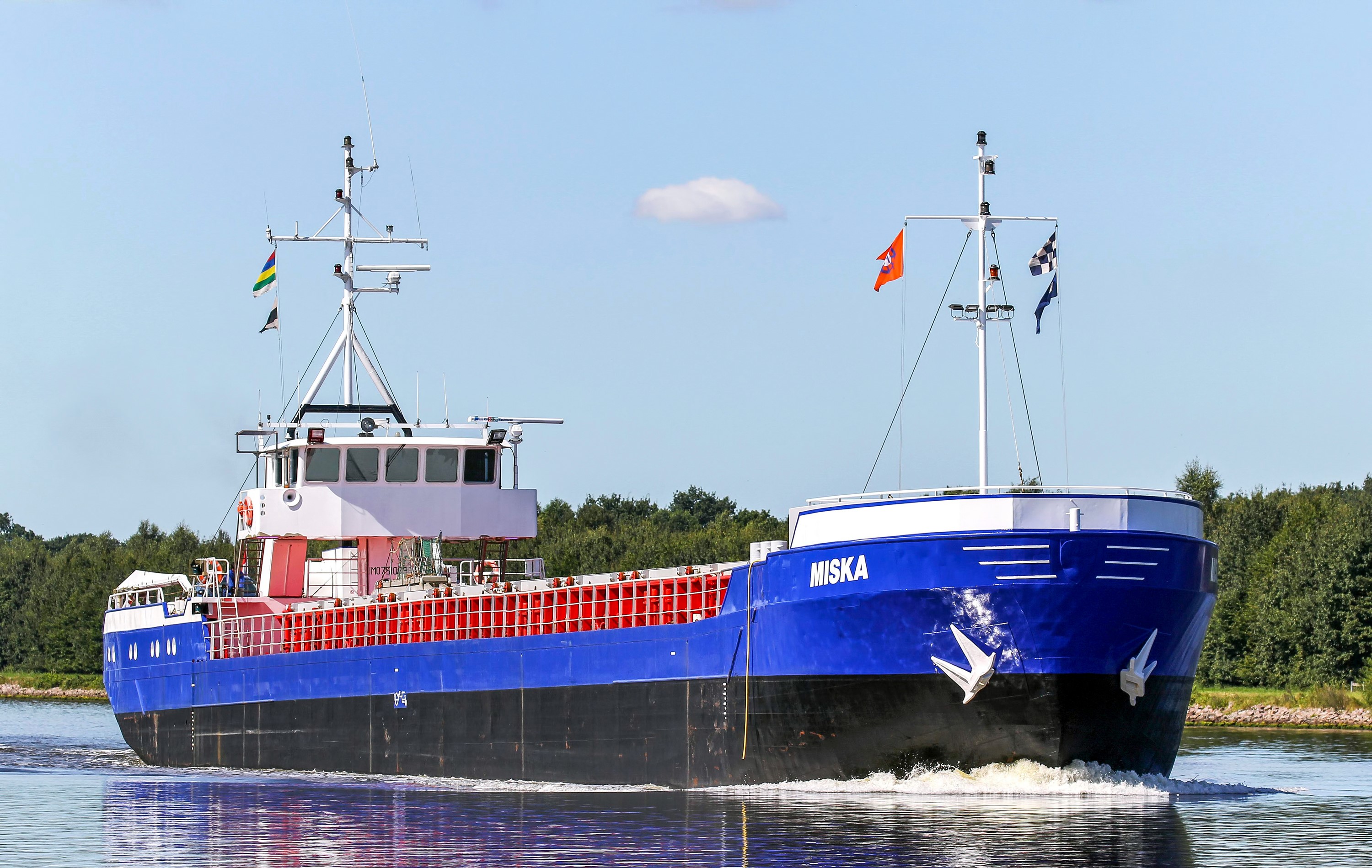 The cargo ship MISKA sails on a canal HD Wallpaper