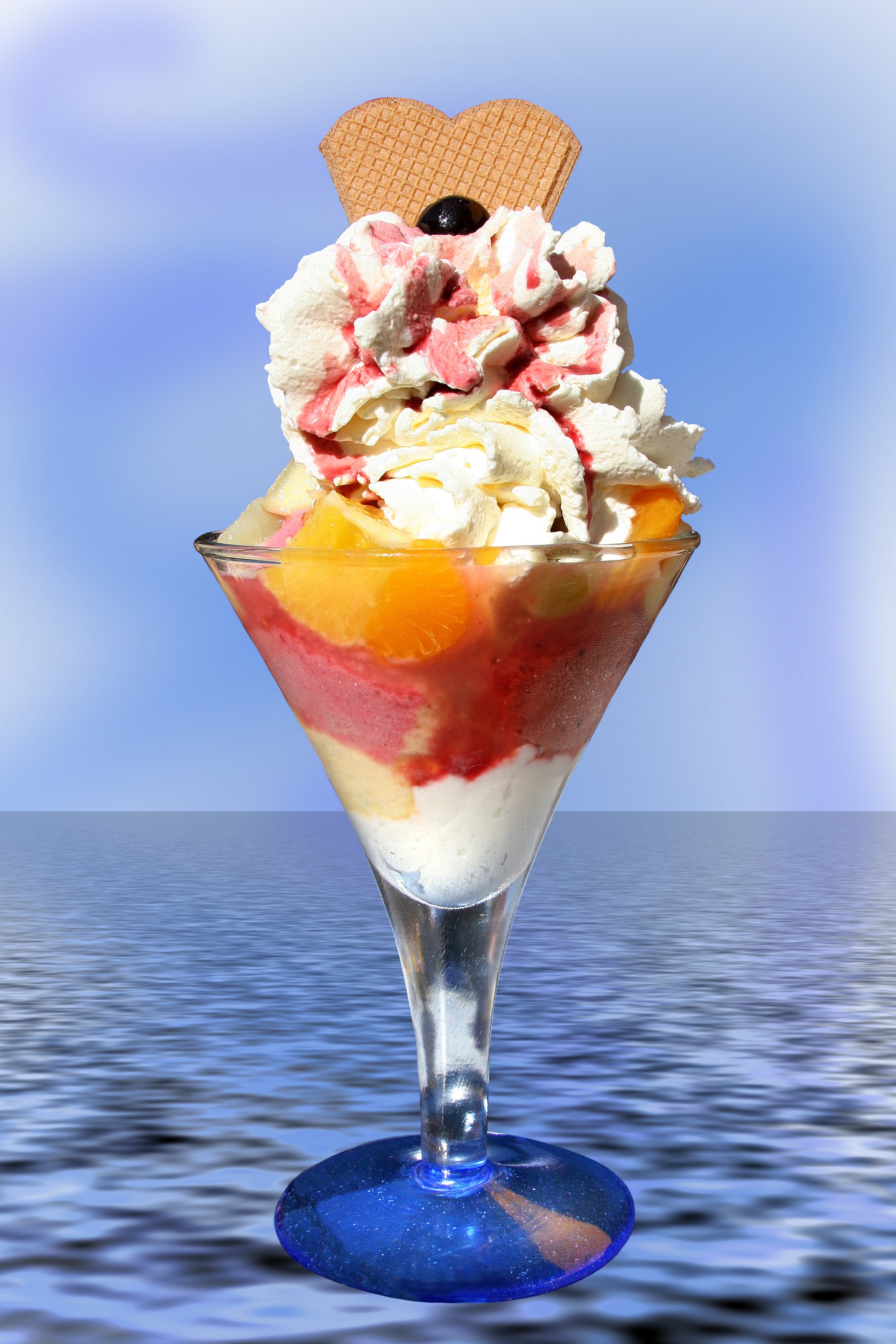 Ice cream sundae in a martini glass with fruit and whipped cream HD Phone Wallpaper