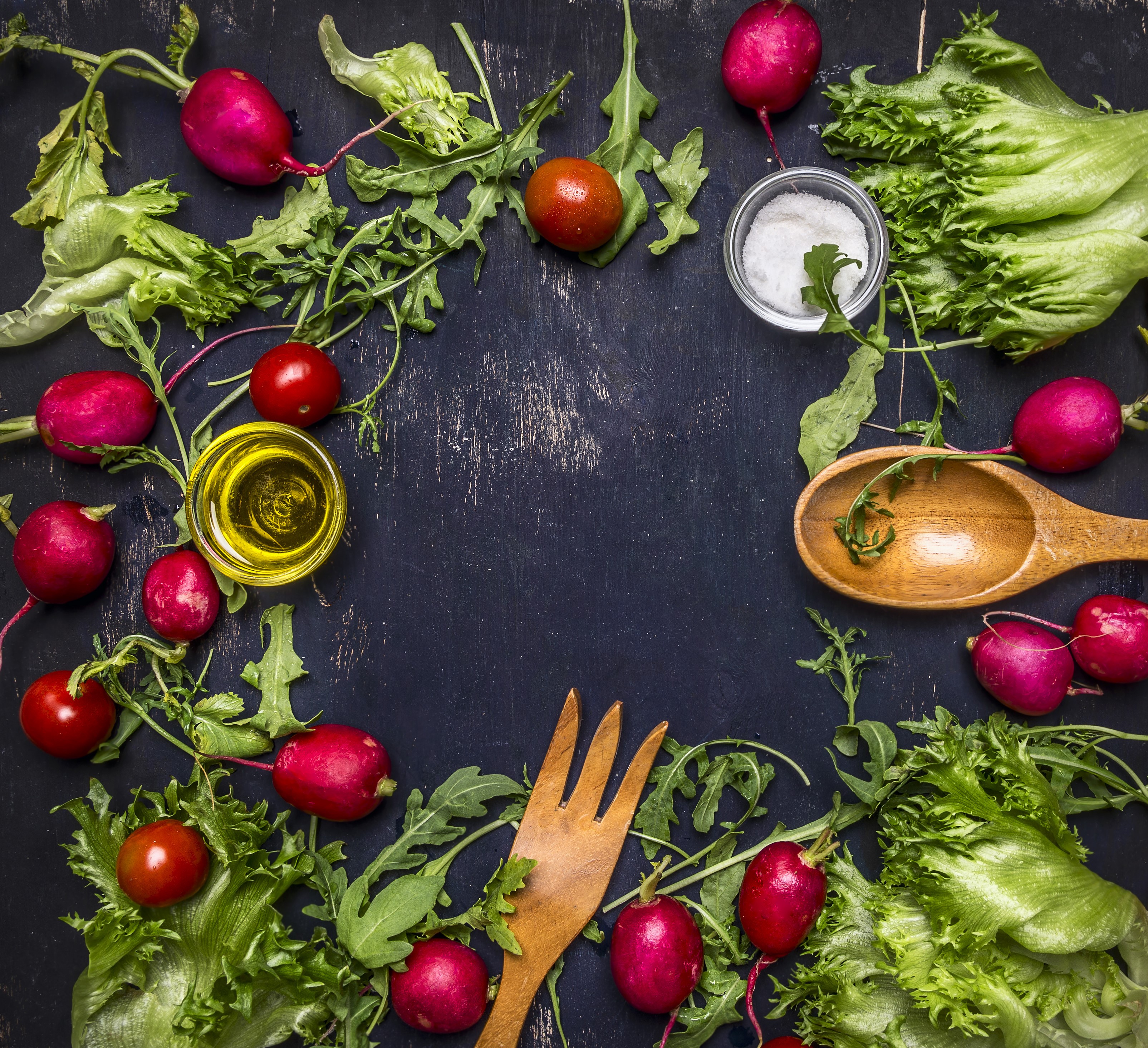Radishes, Lettuce, Tomatoes, Olive Oil, Salt, and Utensils on Dark Surface HD Wallpaper