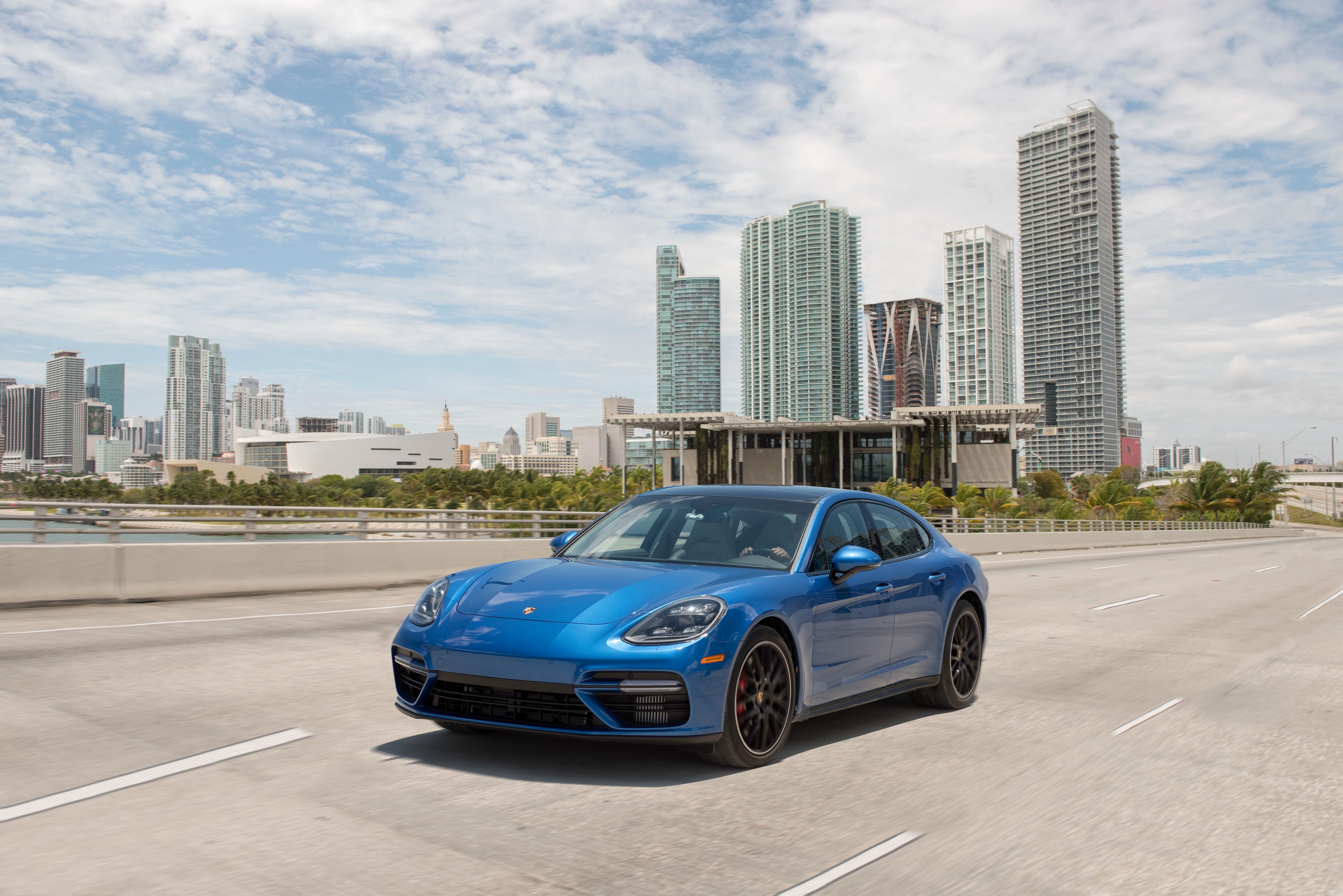 Blue 2017 Porsche Panamera Turbo driving in Miami HD Wallpaper