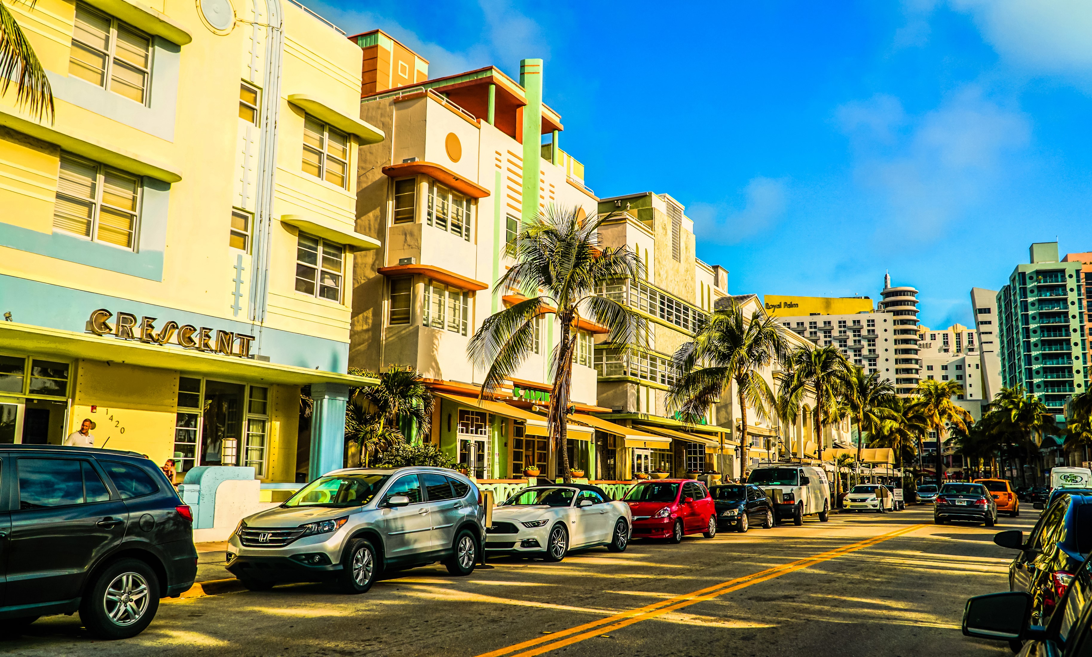 Art Deco buildings and palm trees on a street in Miami, Florida HD Wallpaper
