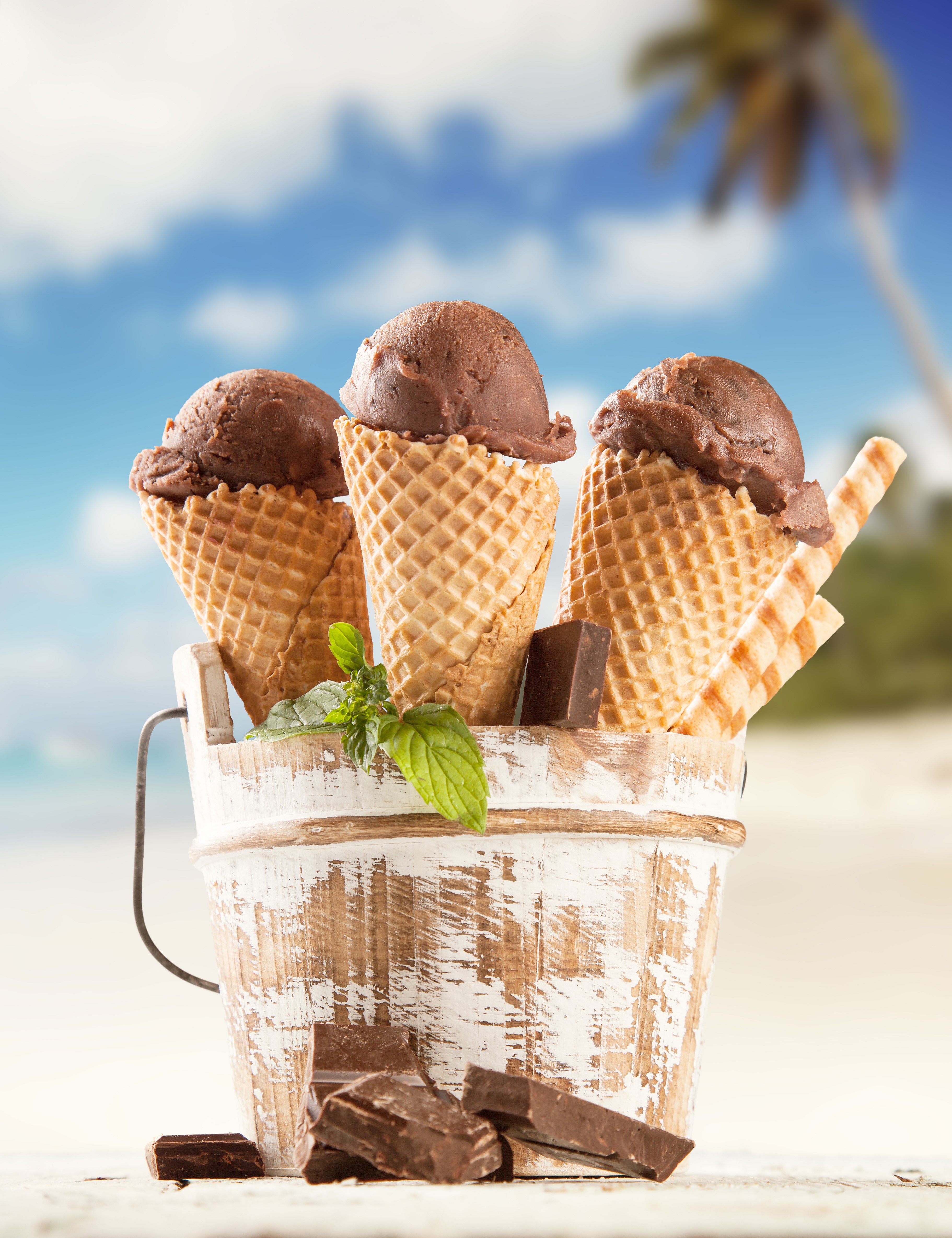 Chocolate ice cream cones in a bucket on a beach HD Phone Wallpaper