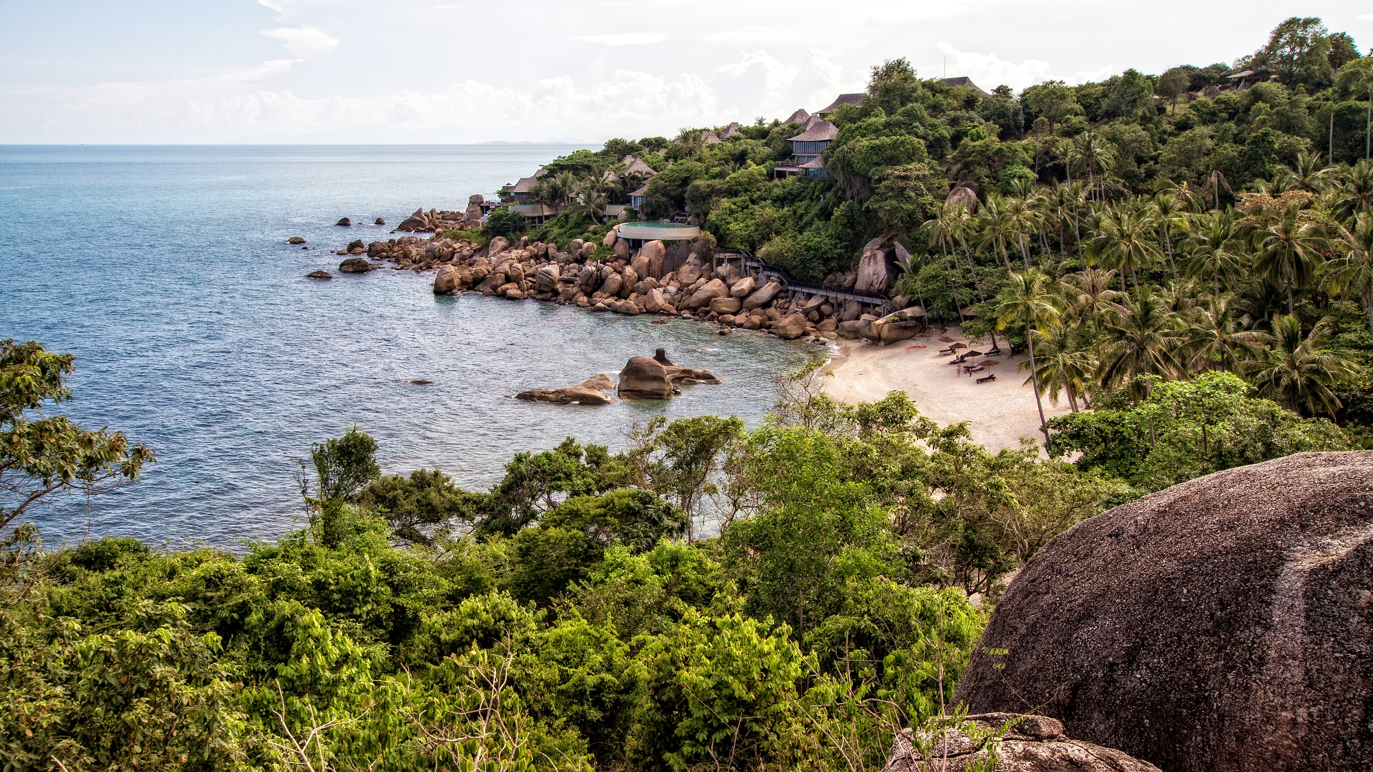 4K Tropical Beach with Rocky Coastline and Palm Trees in Thailand HD Wallpaper