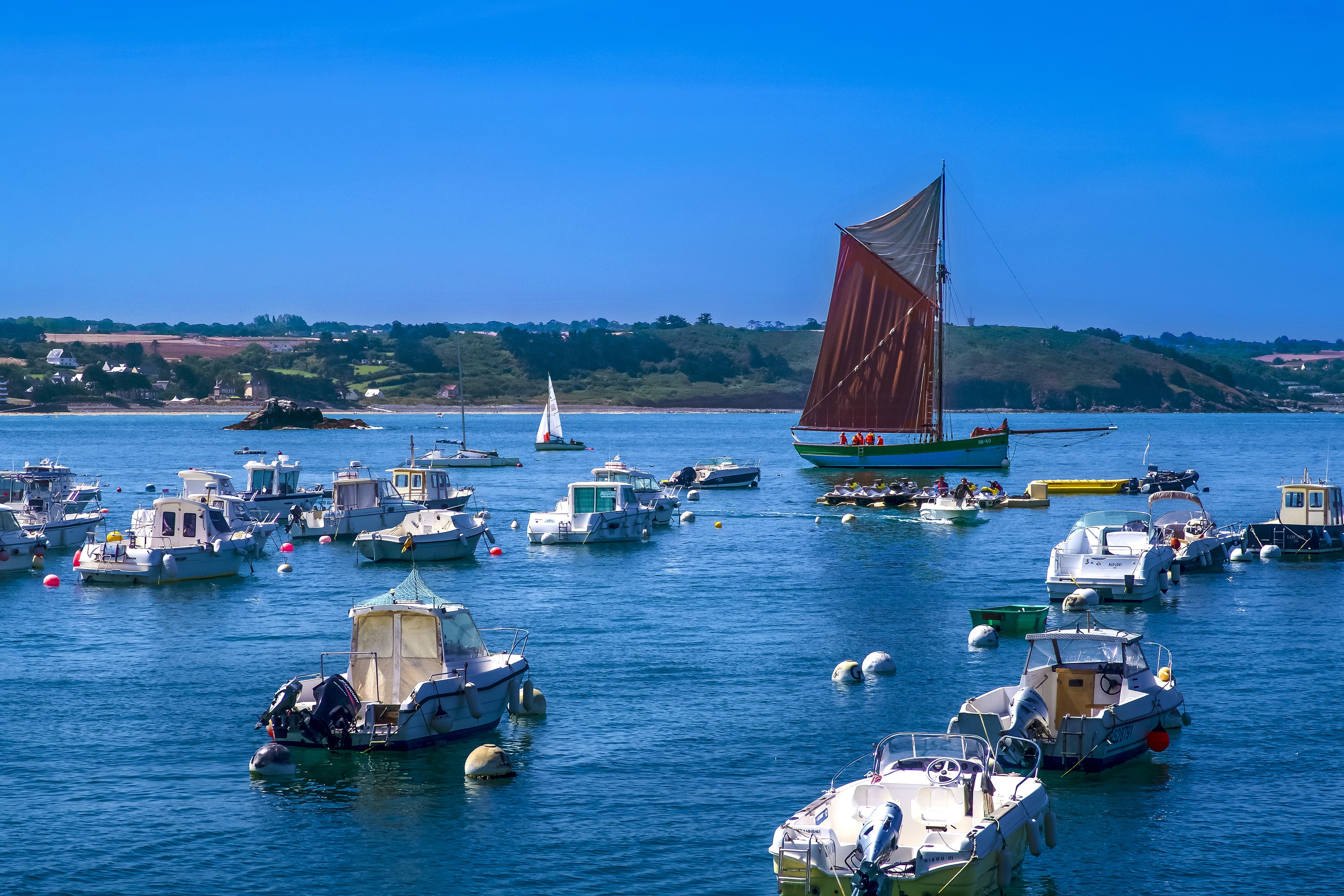 Boats in a bay in Erquy, Brittany, France HD Wallpaper