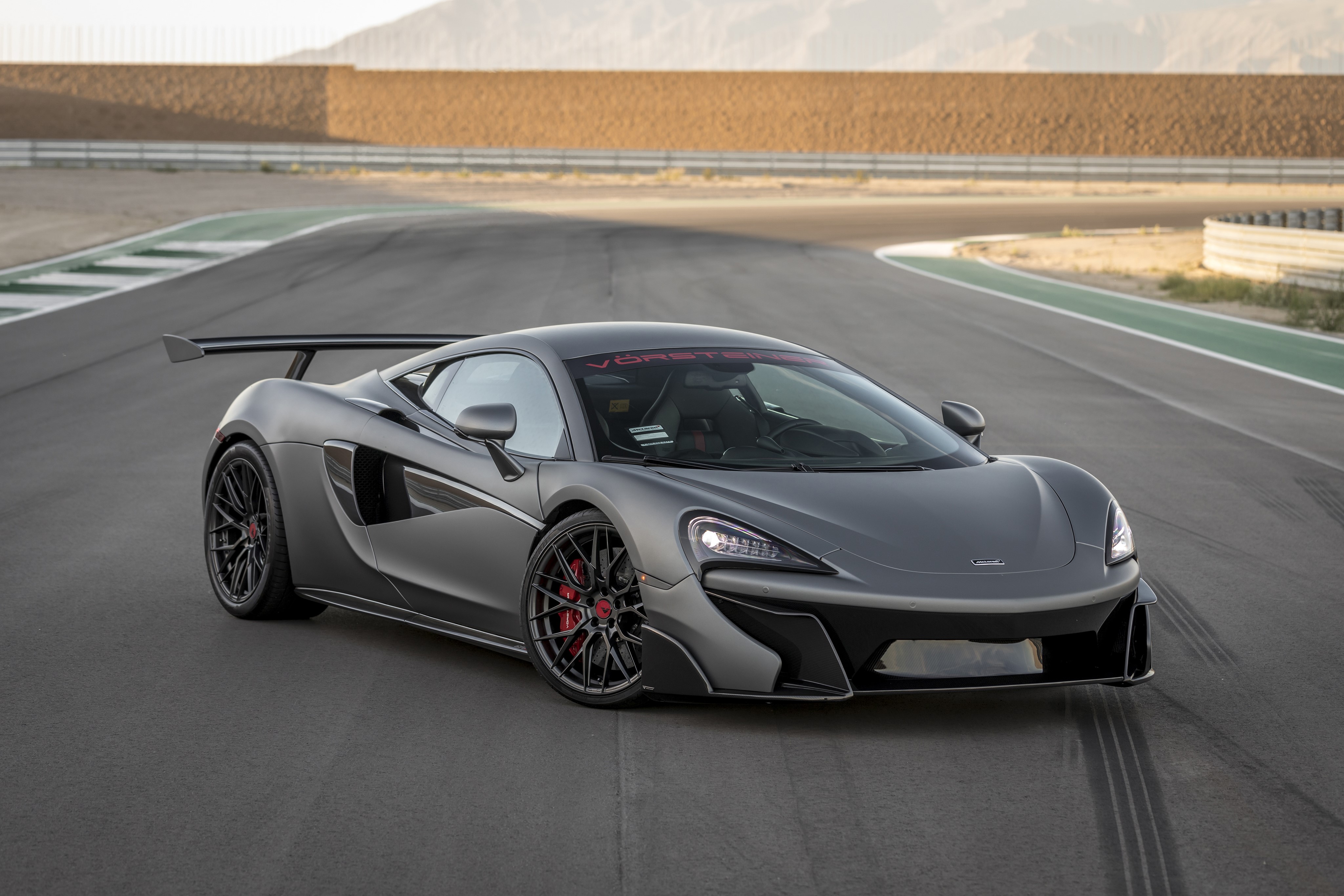 Grey McLaren 570-VX Aero by Vorsteiner on a Racetrack HD Wallpaper