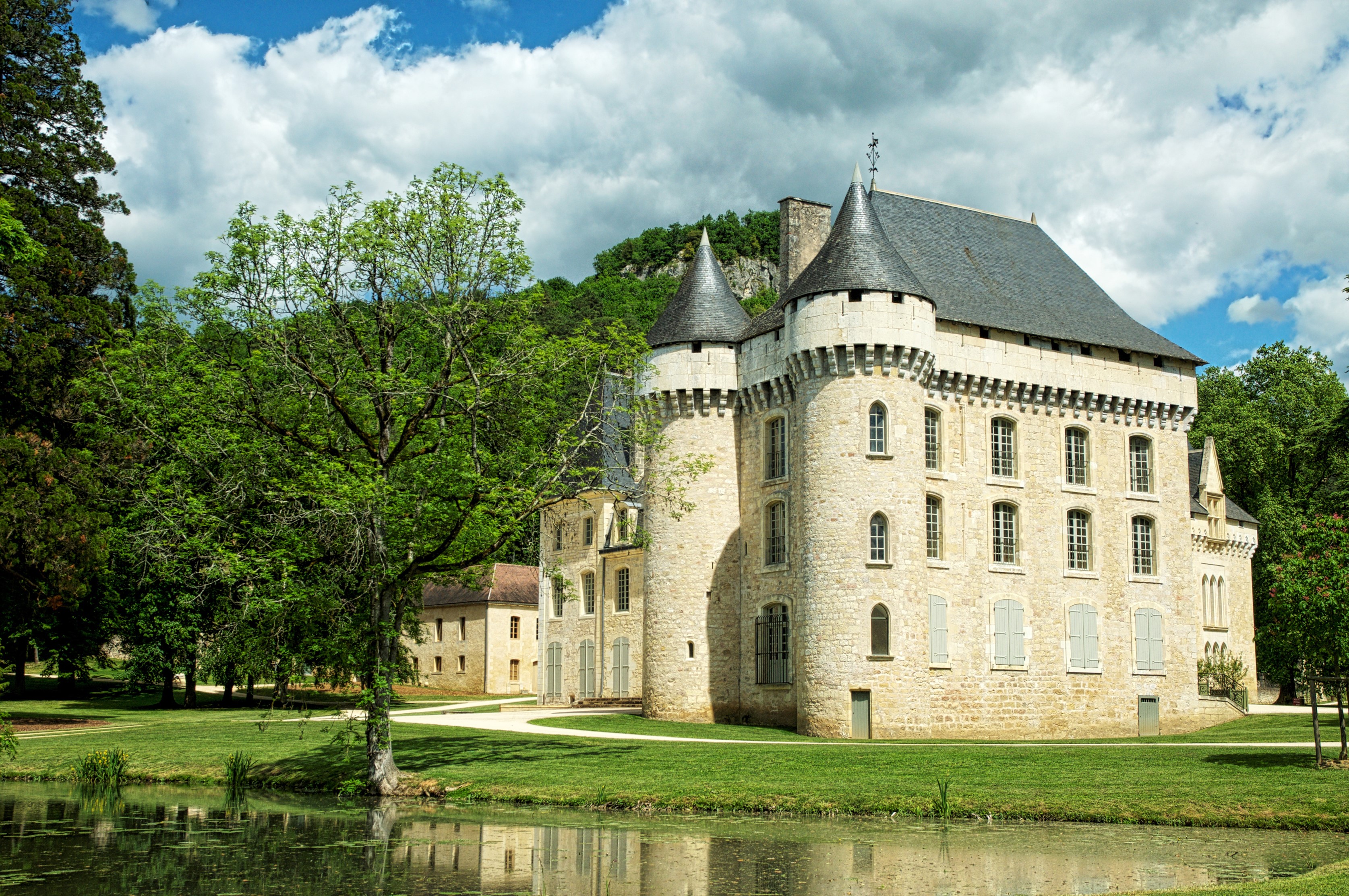Chateau de Lalande in France with a pond and trees HD Wallpaper