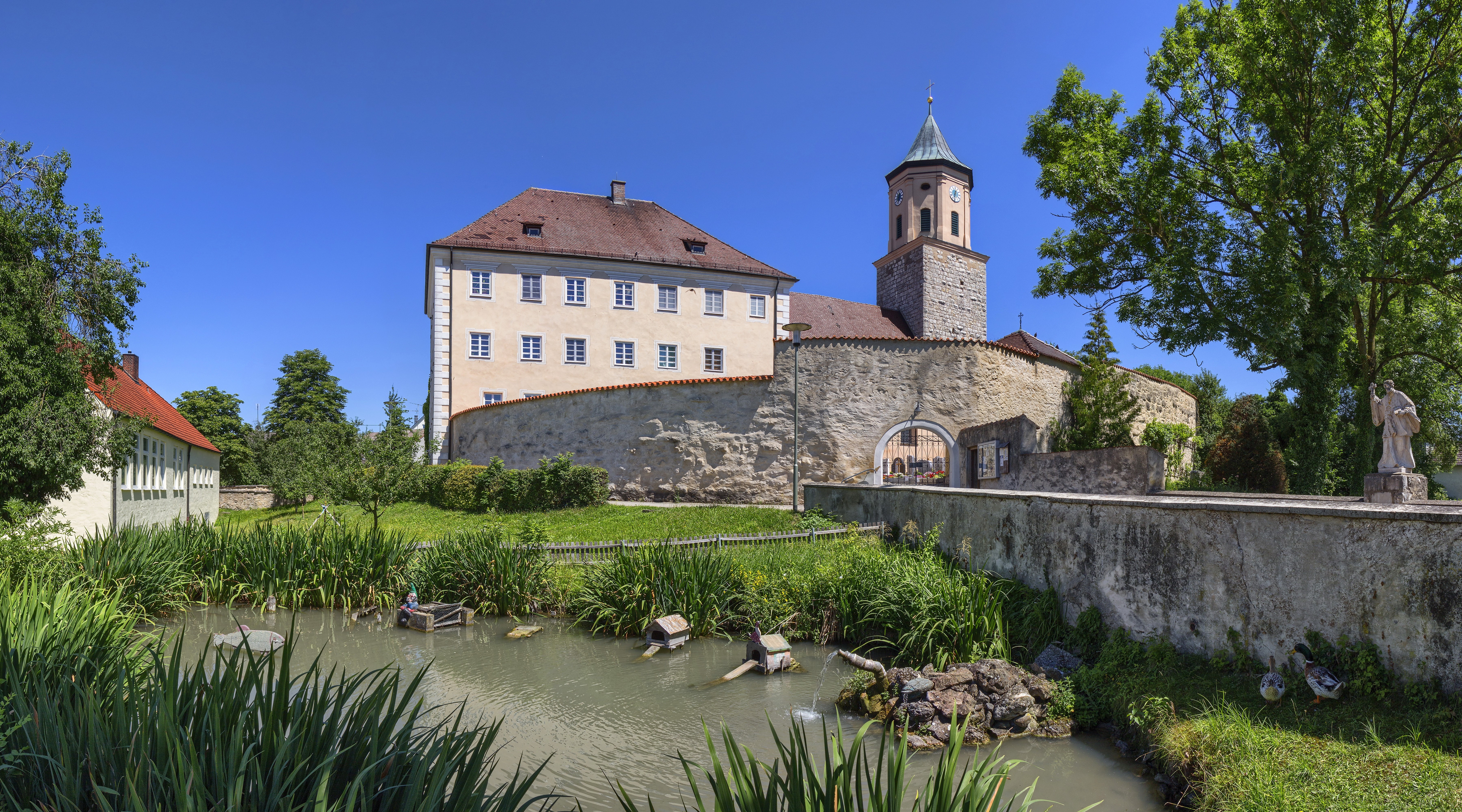 Monastery building with tower and pond in Gosheim, Germany HD Wallpaper