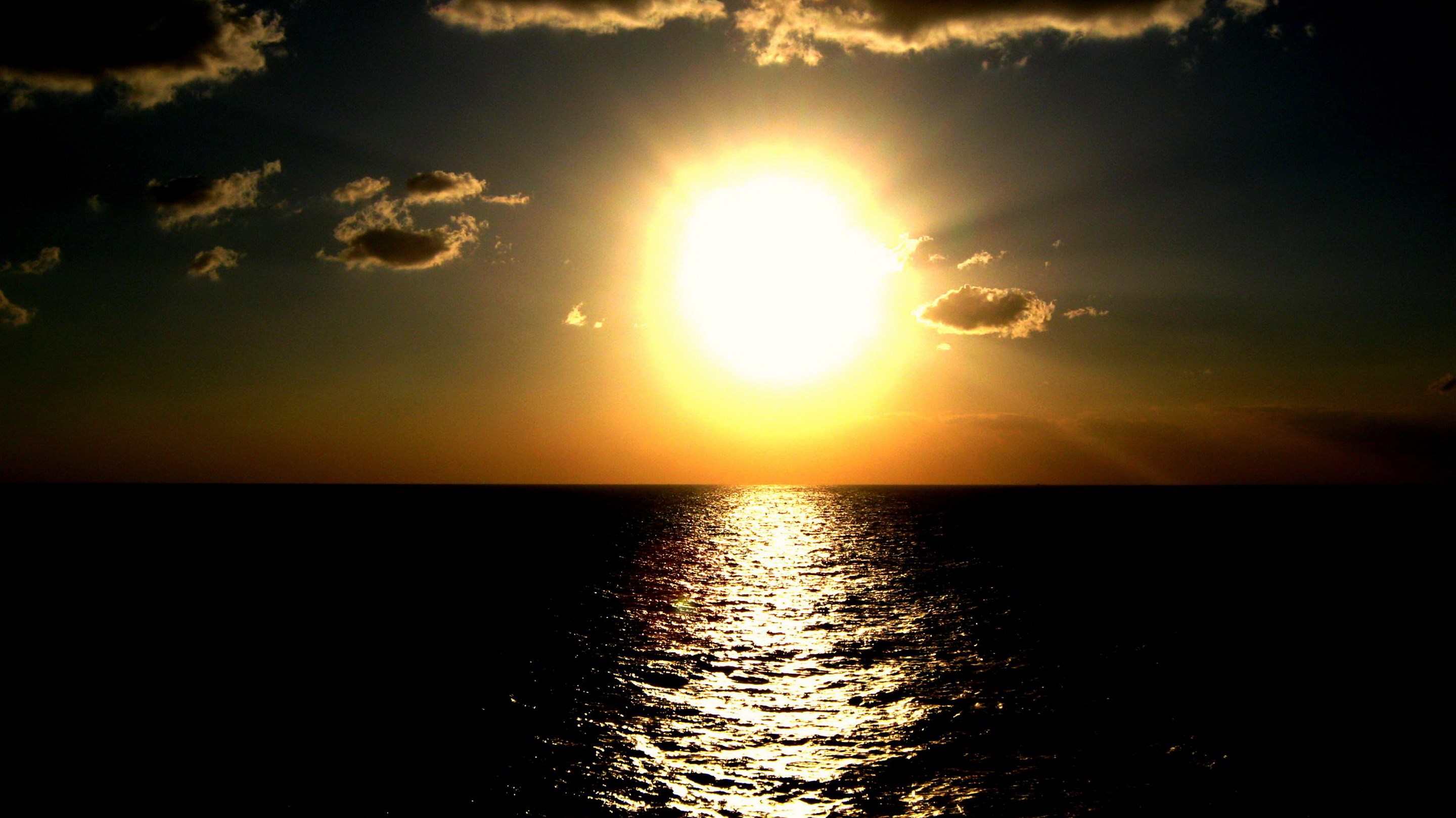 Sunset over the ocean with clouds HD Wallpaper