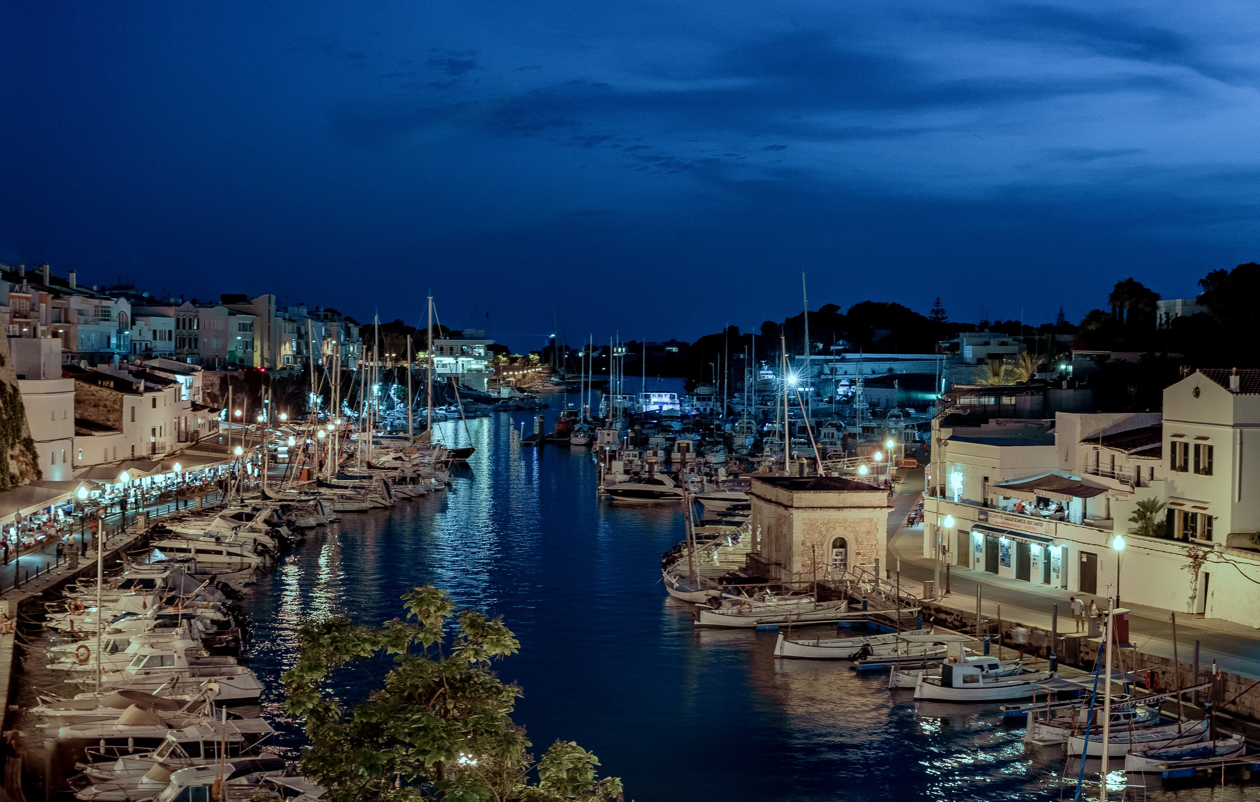 Ciutadella harbor at night with boats and buildings HD Wallpaper