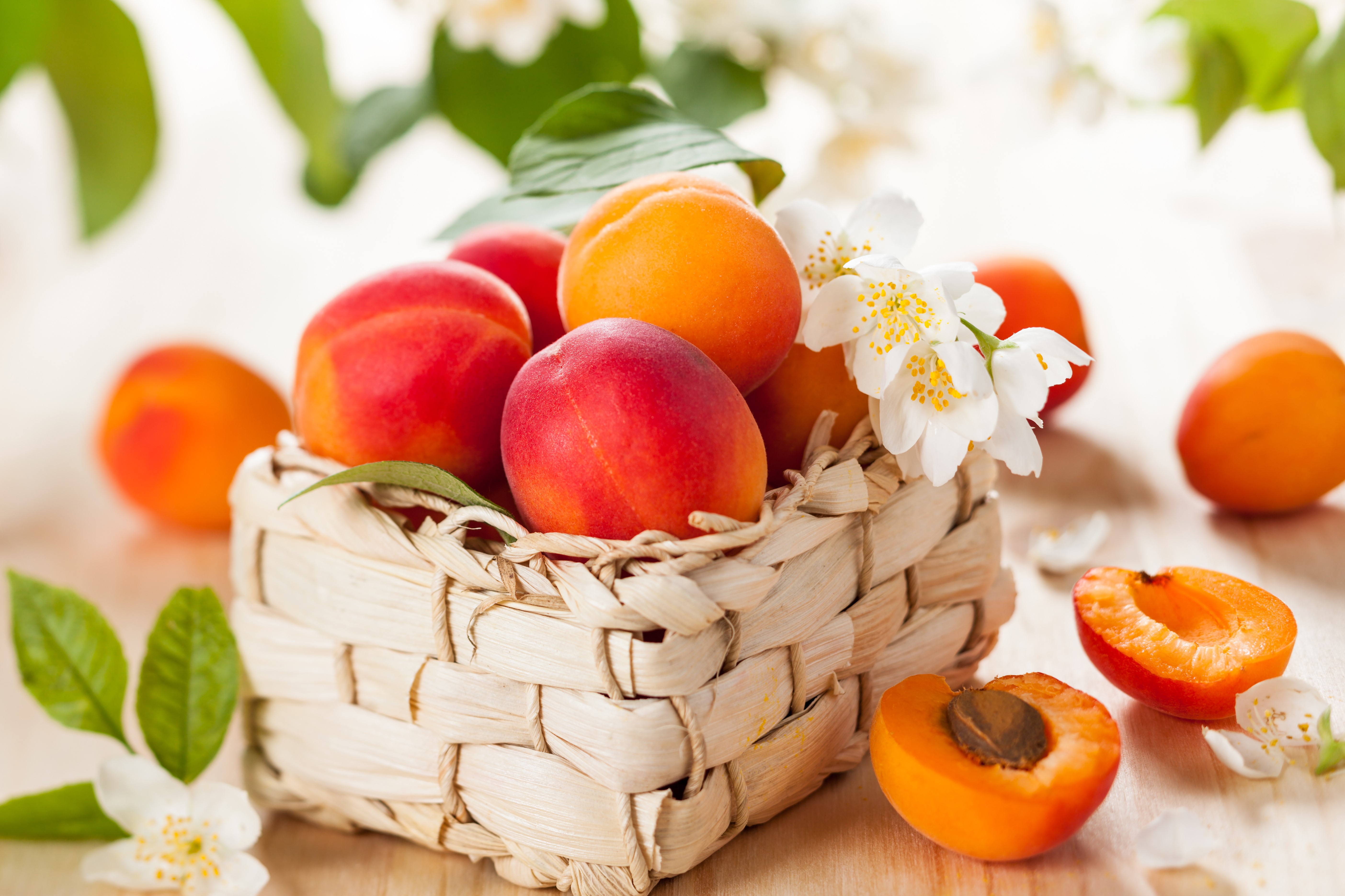 Apricots in a Wicker Basket with Jasmine Flowers HD Wallpaper