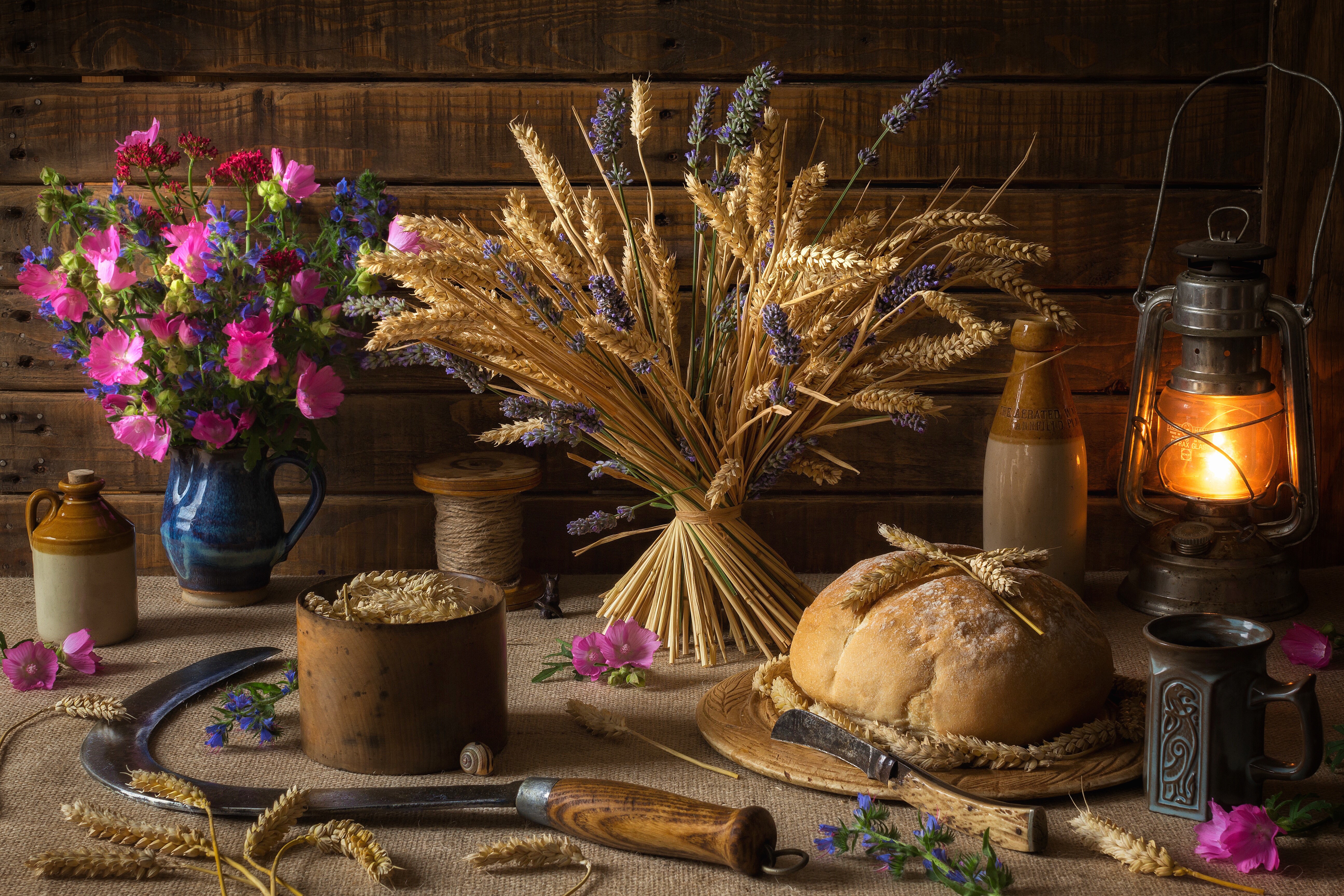 Still-life with bread, flowers, wheat, and kerosene lamp HD Wallpaper