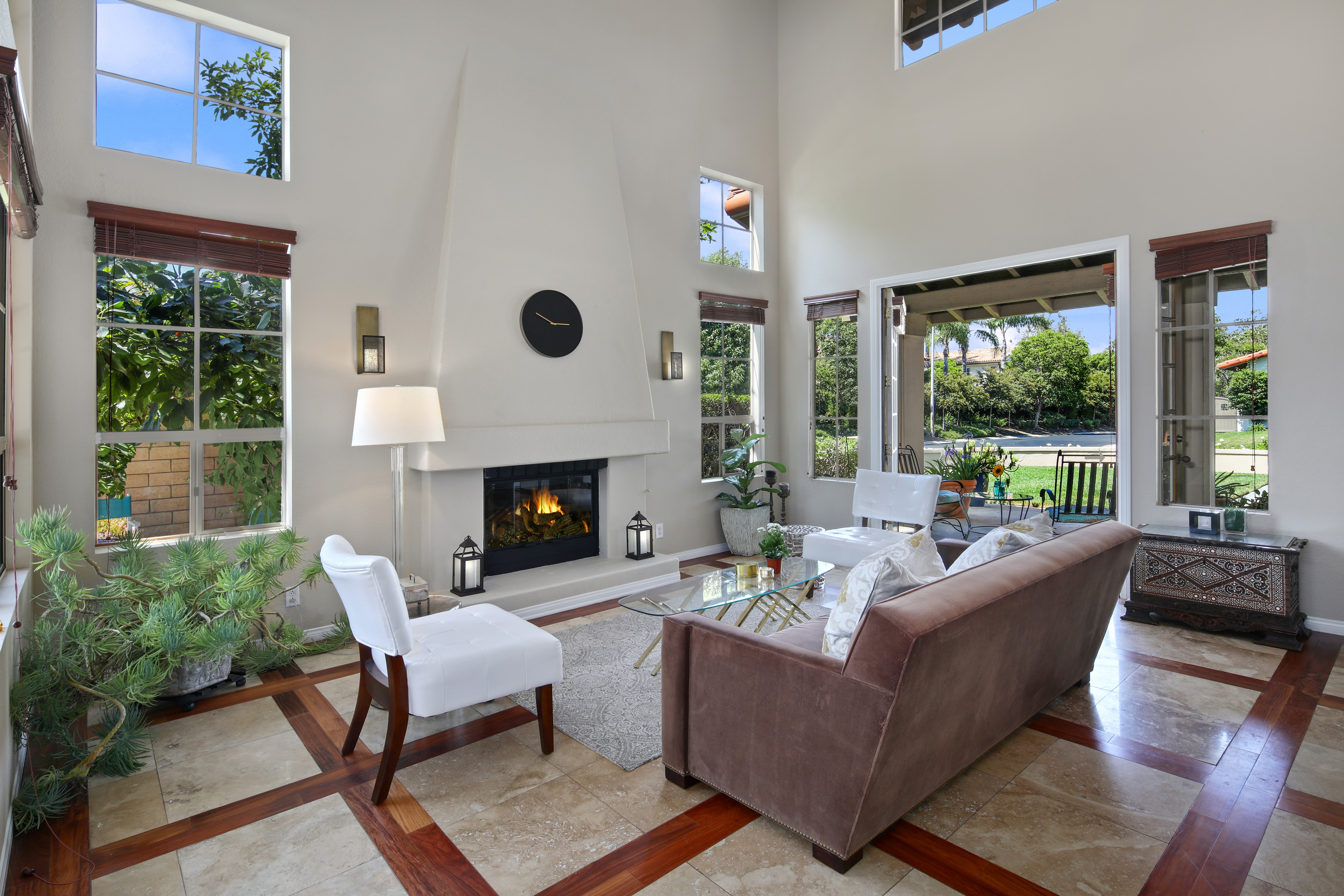 Living room with fireplace, sofa, and chairs HD Wallpaper