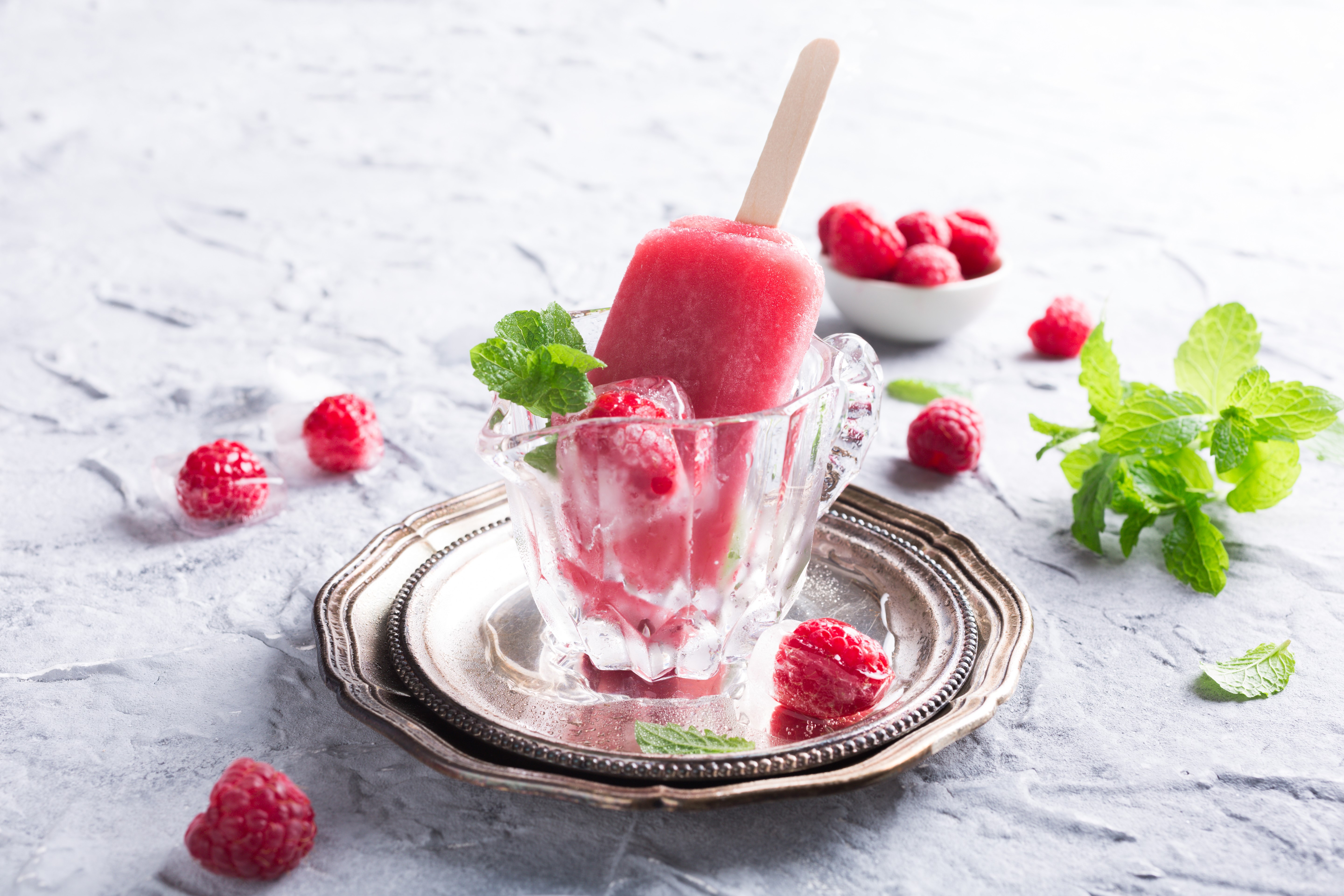Raspberry popsicle in a glass cup with mint and raspberries HD Wallpaper
