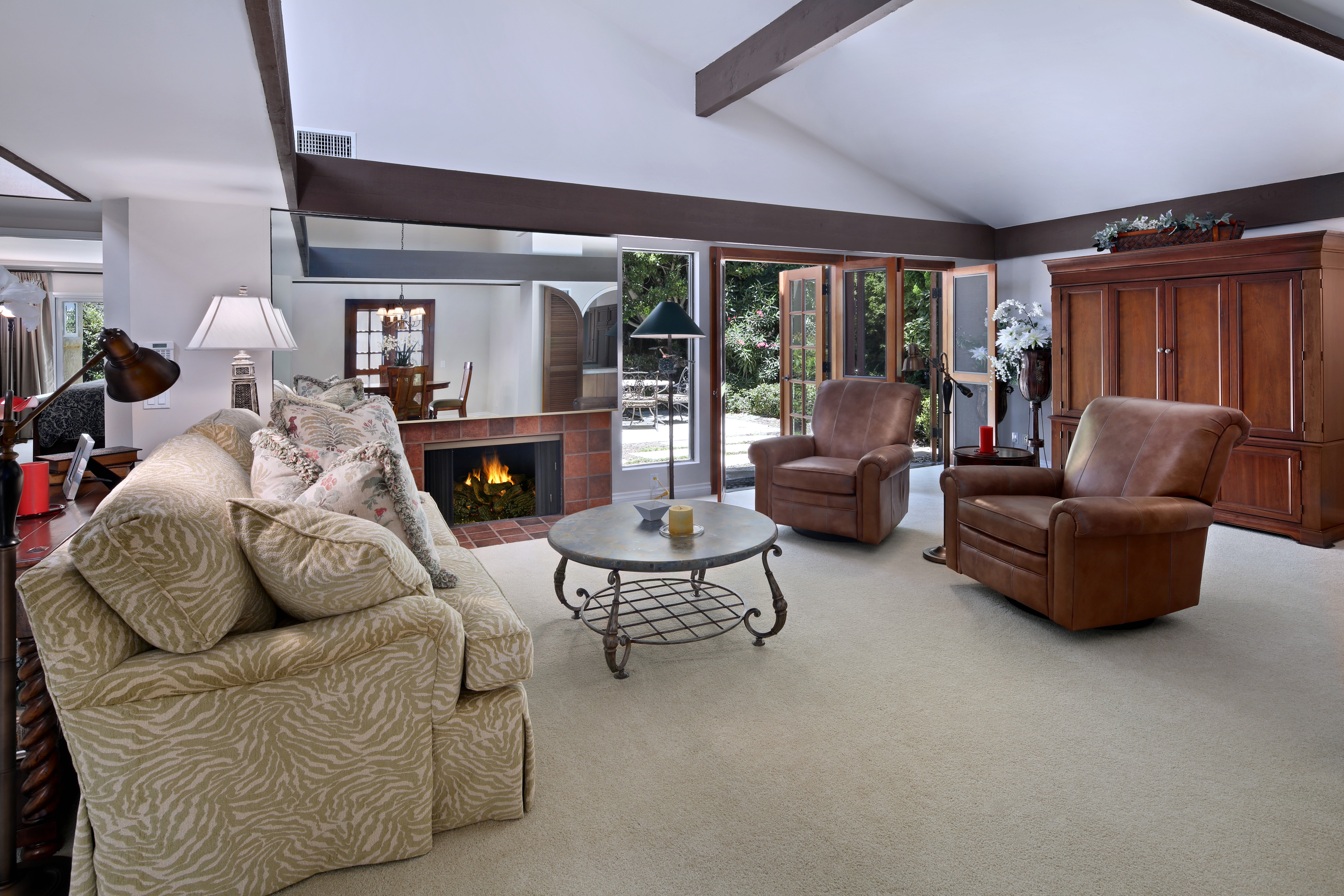 Living room with fireplace, sofa, and armchairs HD Wallpaper