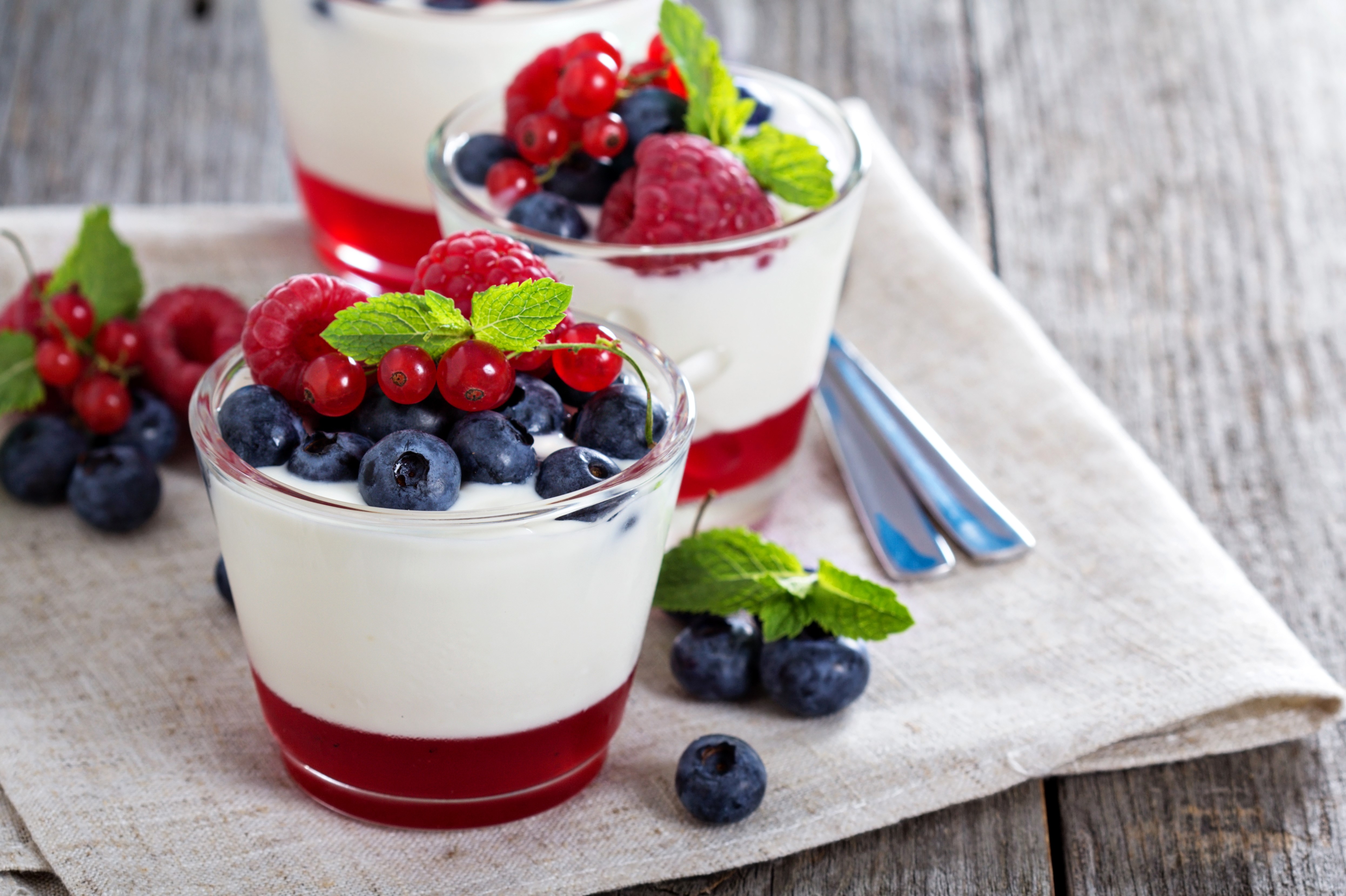 Yogurt with berries and jelly in glasses HD Wallpaper