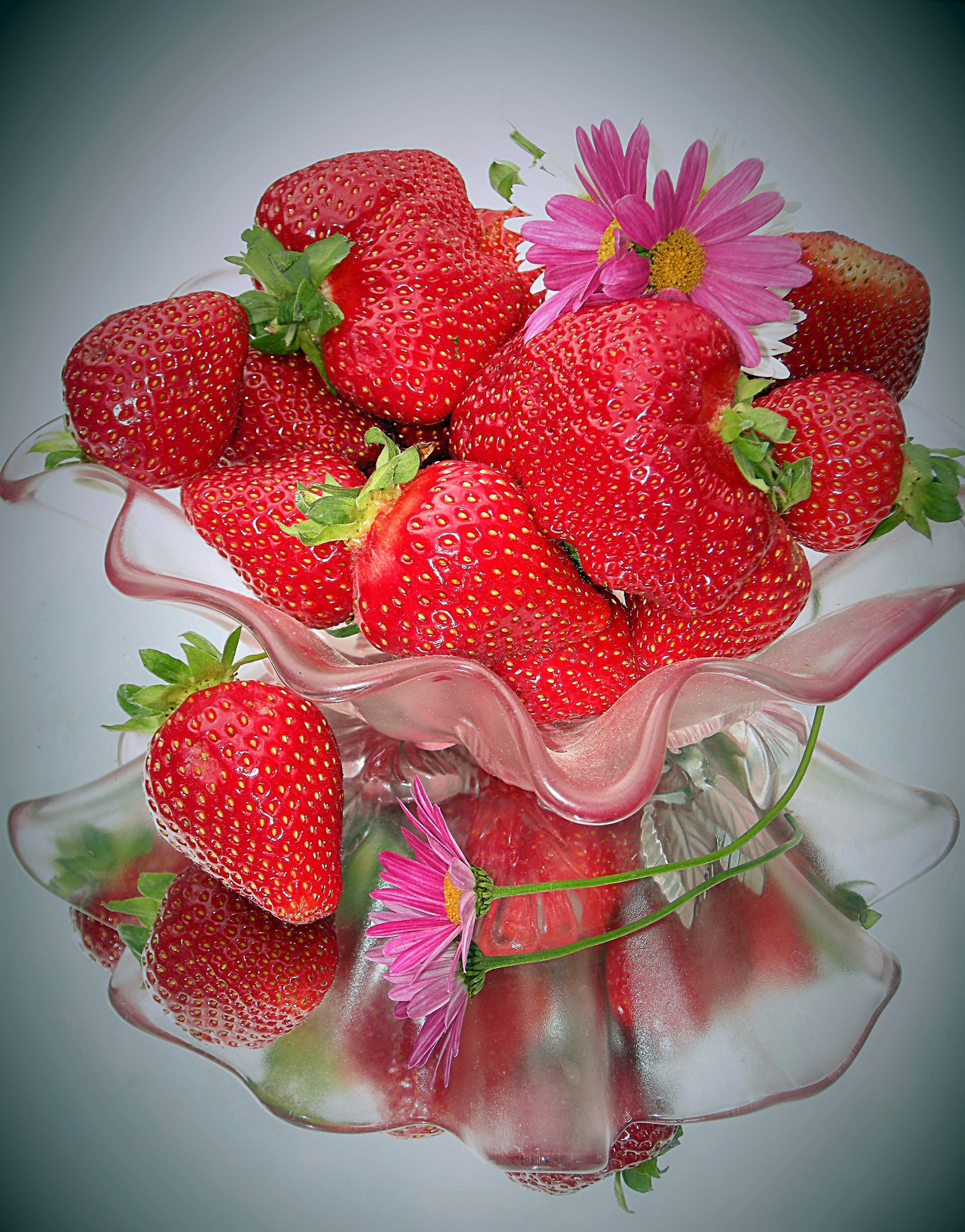 Strawberries in a pink glass bowl with flowers HD Phone Wallpaper