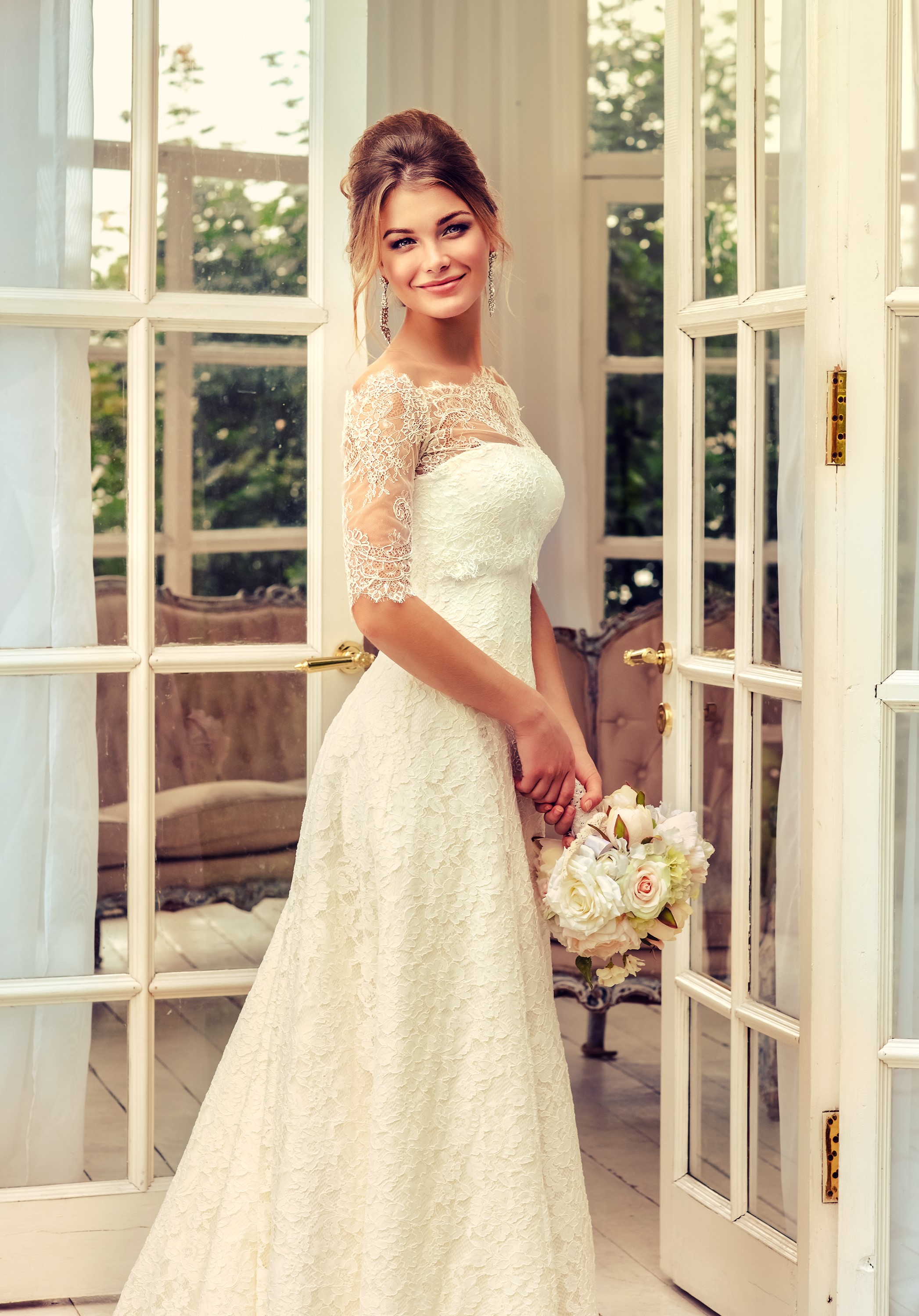 Bride in a lace dress holding a bouquet HD Phone Wallpaper
