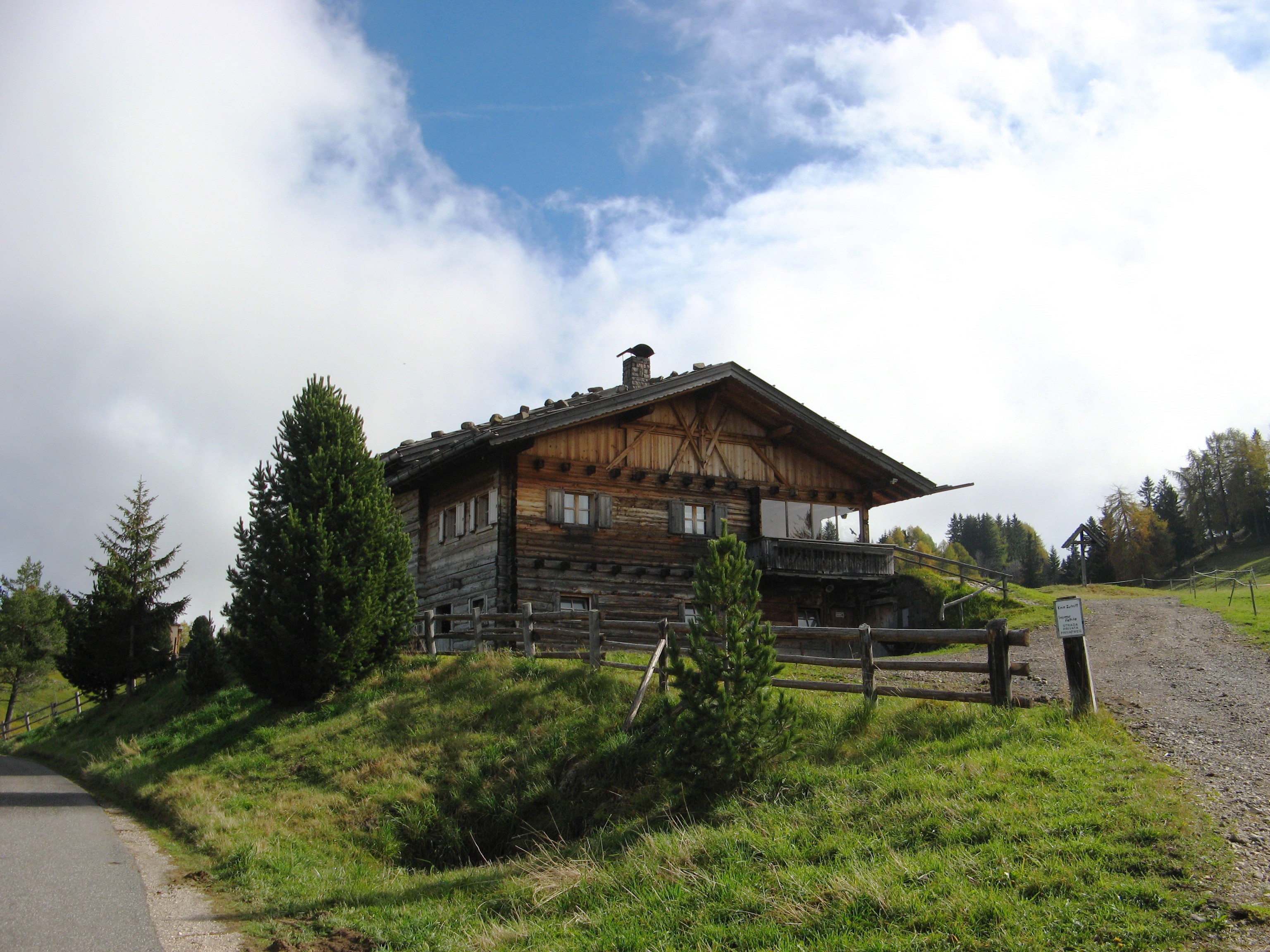 Wooden house with fence in Bellavista, Italy HD Wallpaper