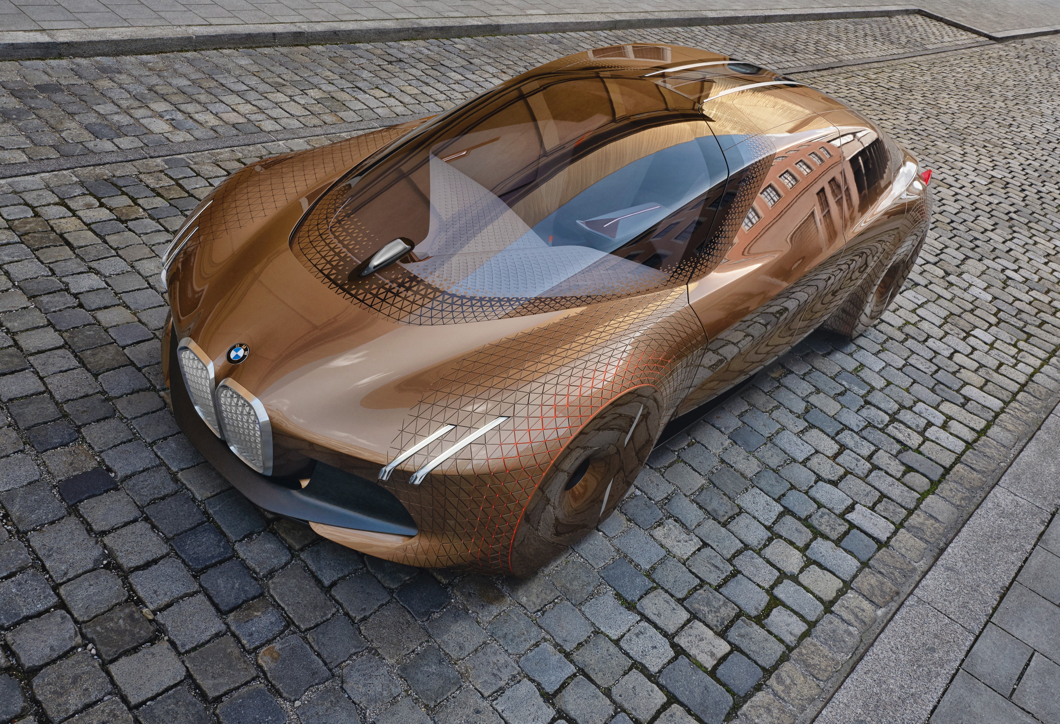 BMW Concept Vision Next 100 car on cobblestone street HD Wallpaper