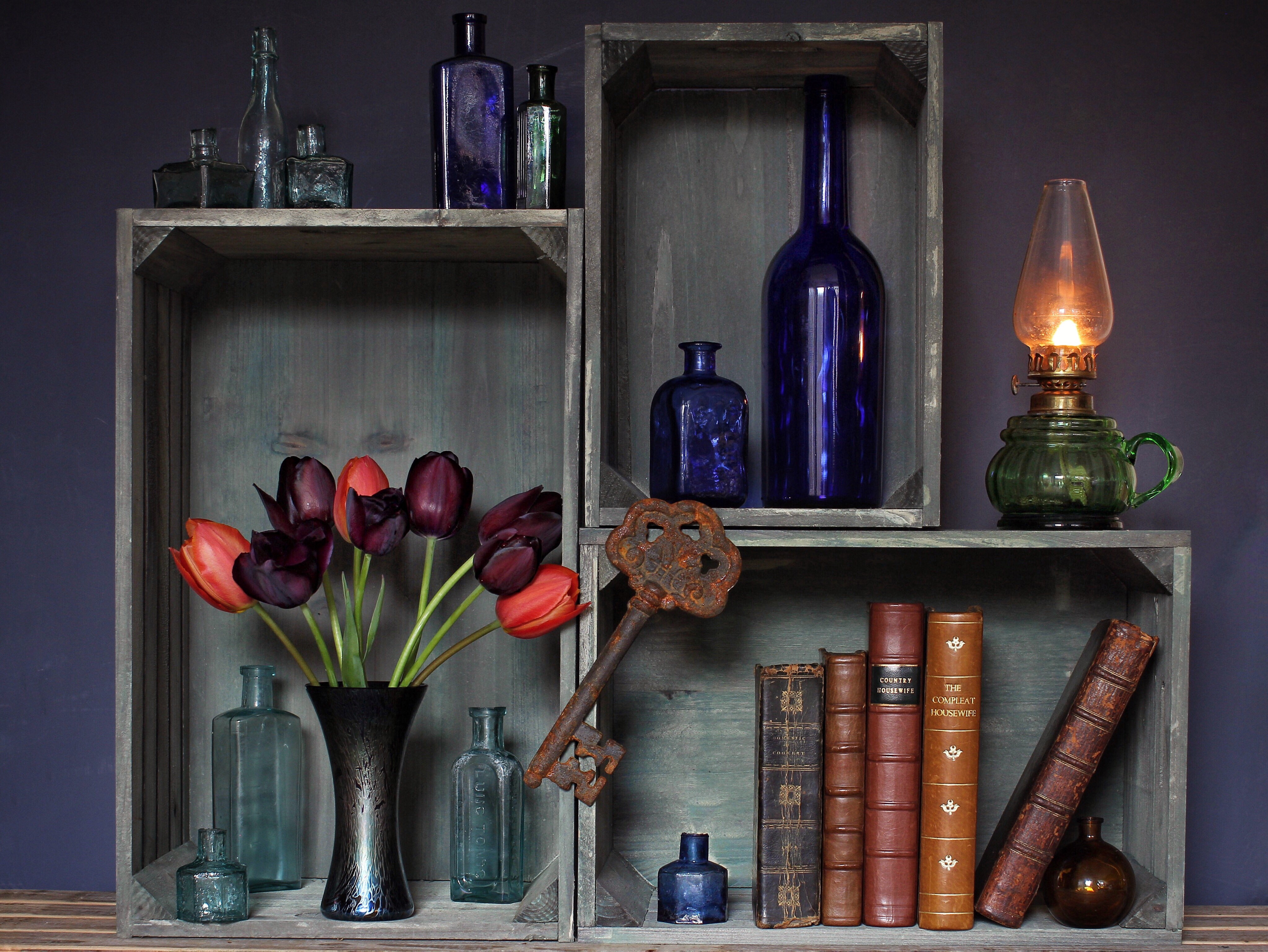 Still-life with Tulips, Books, Bottles, and Kerosene Lamp HD Wallpaper