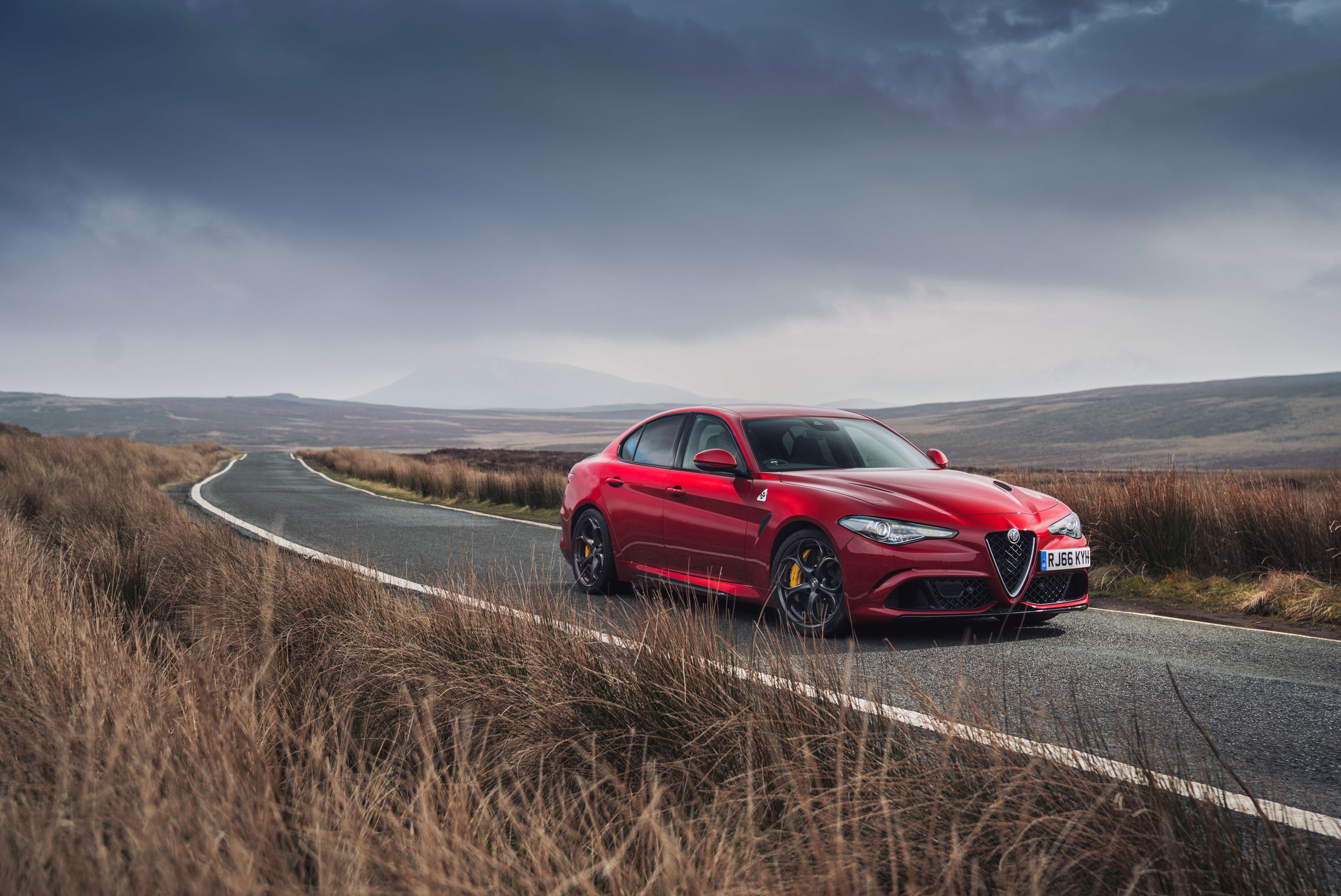 Red Alfa Romeo Giulia Quadrifoglio on a Road HD Wallpaper