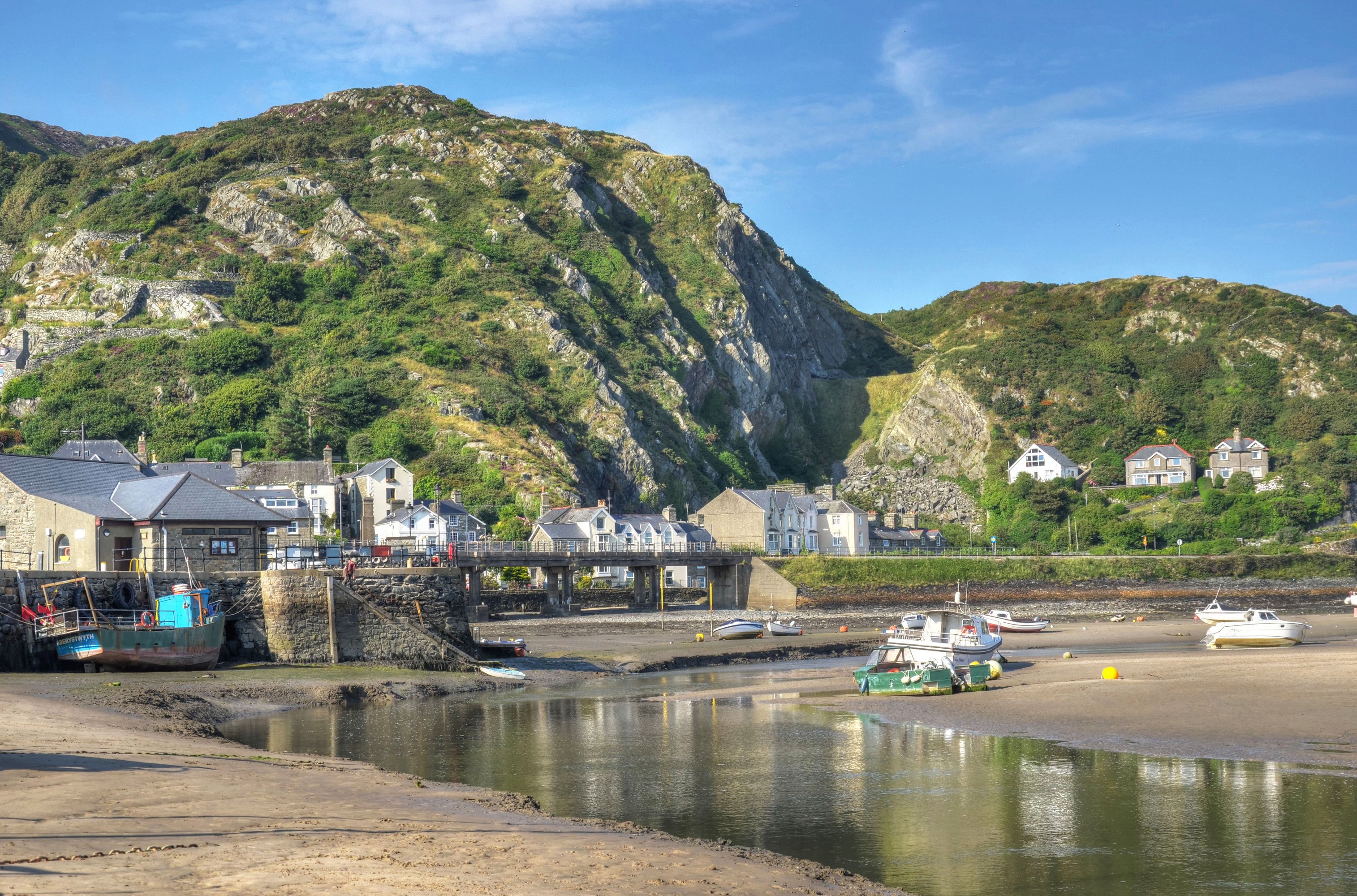 Barmouth, Wales: Coastal town with boats and hills HD Wallpaper