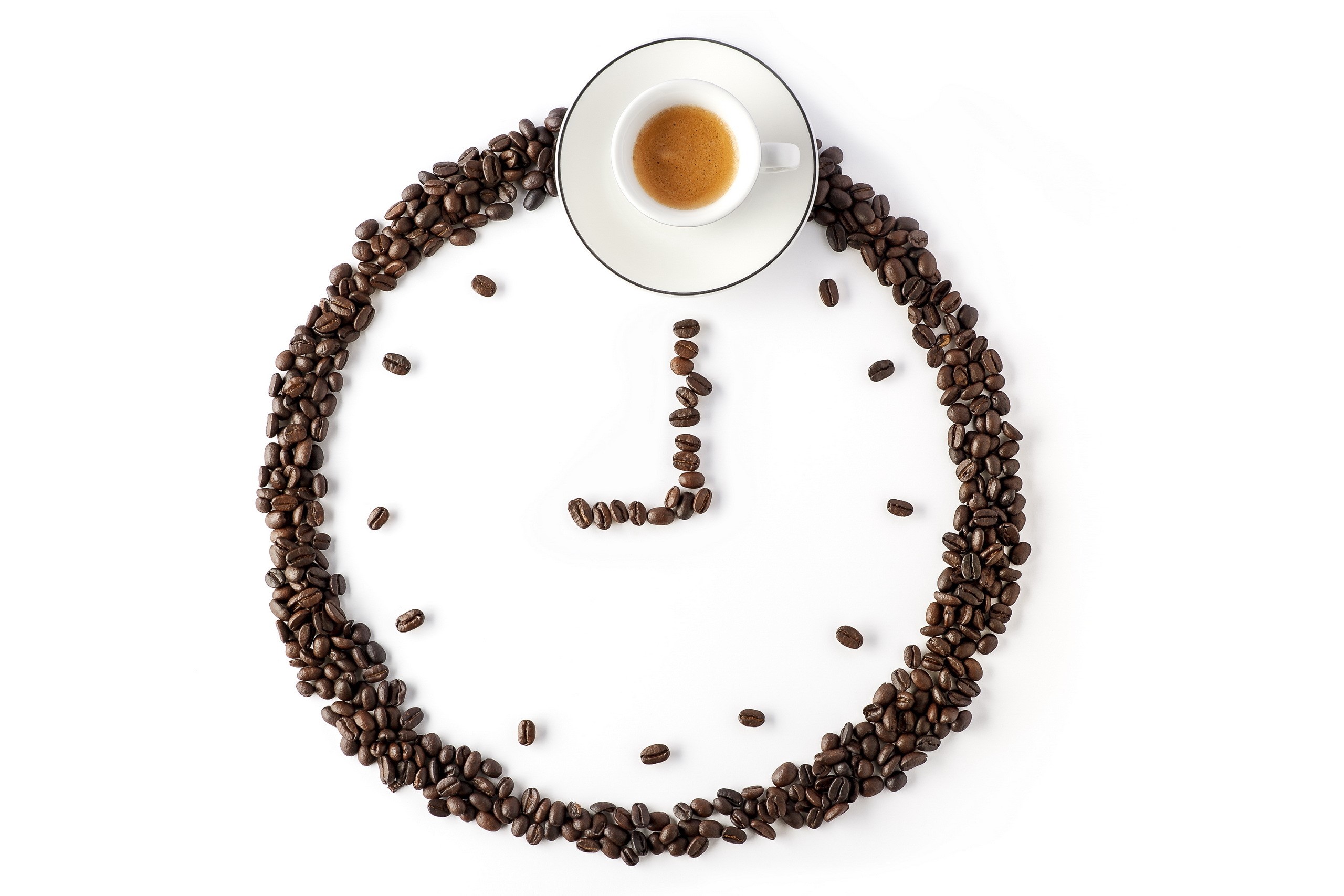 Coffee beans arranged as a clock with a cup of espresso HD Wallpaper