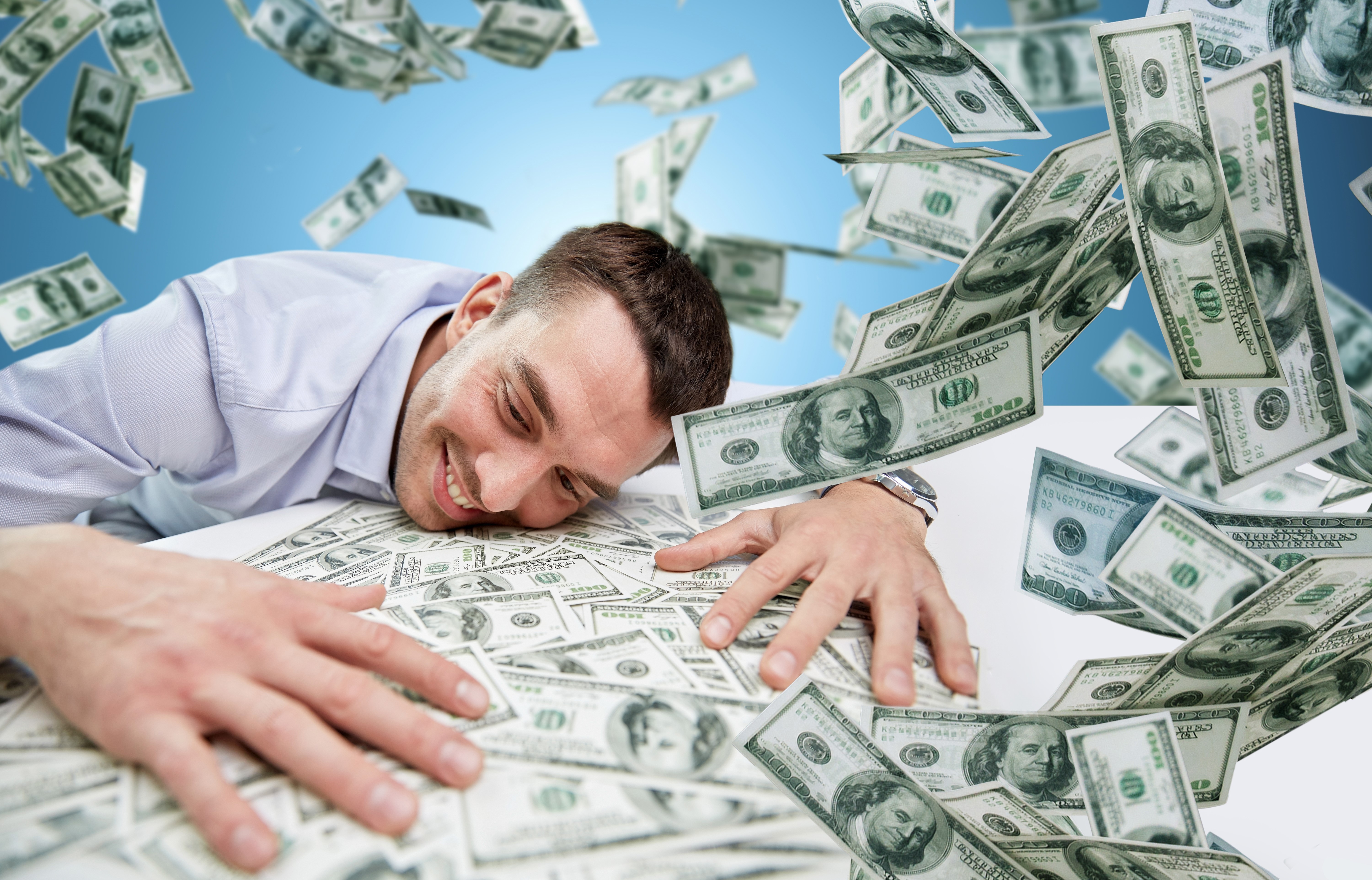 Man happily embracing falling US dollar banknotes HD Wallpaper