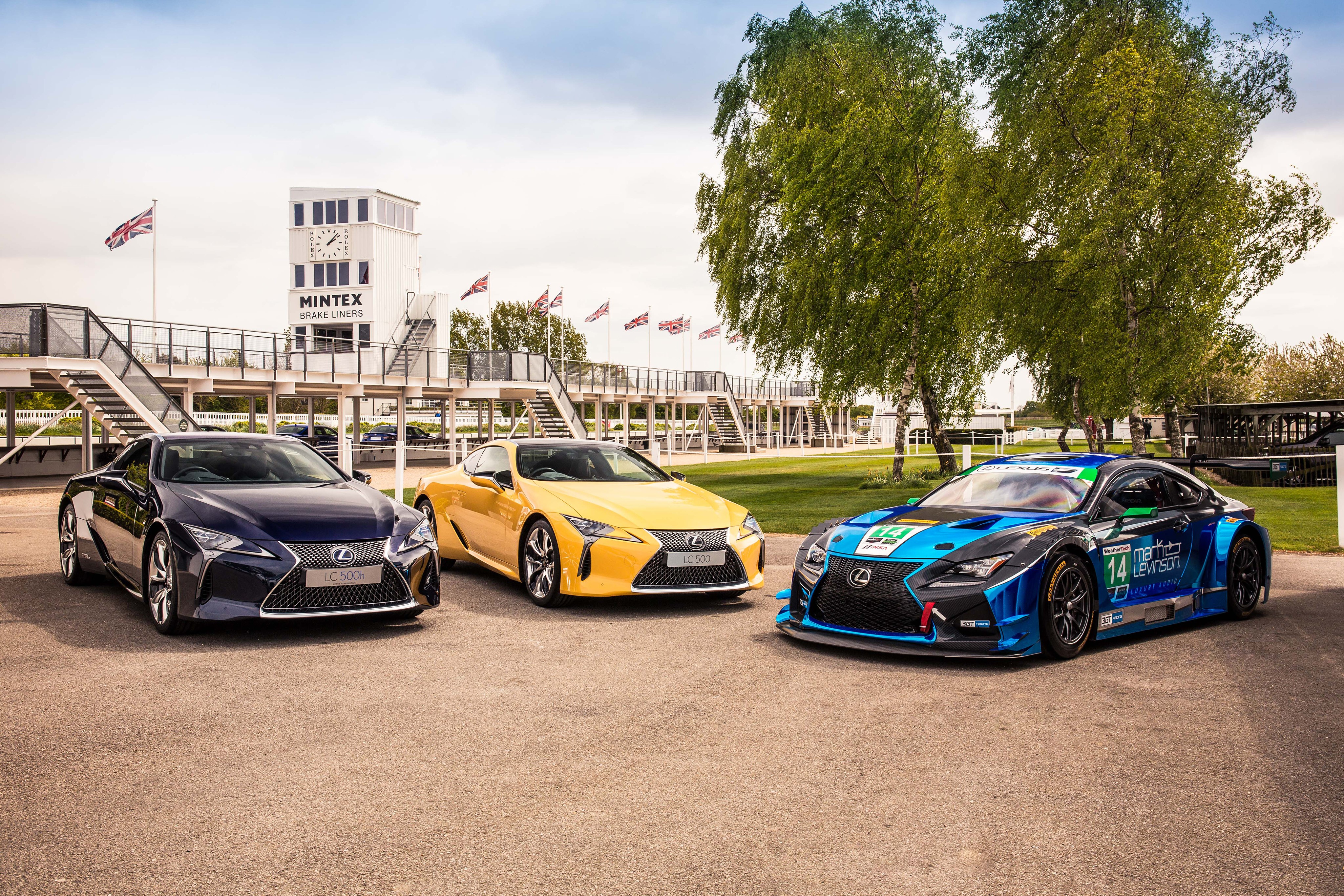 Three Lexus LC 500h Cars at Racetrack HD Wallpaper