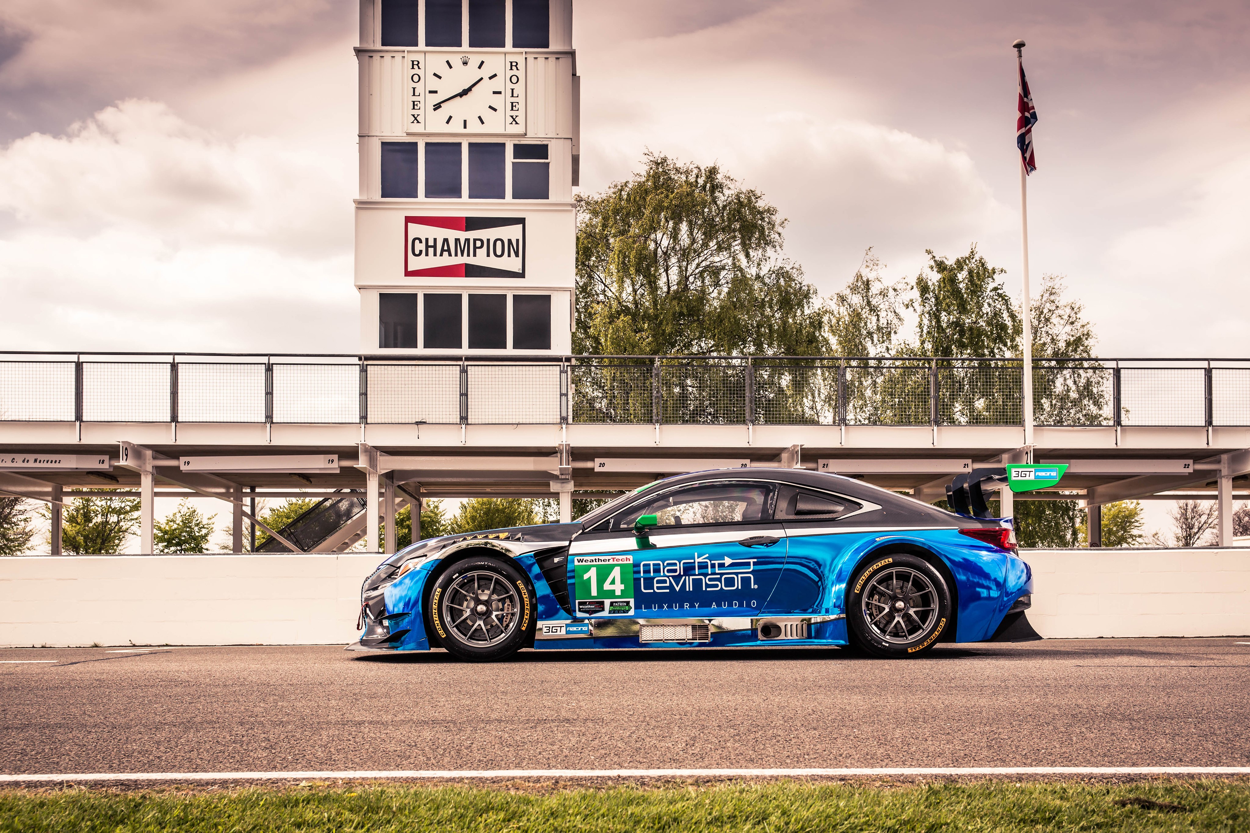Lexus RC F GT3 race car with Rolex tower HD Wallpaper