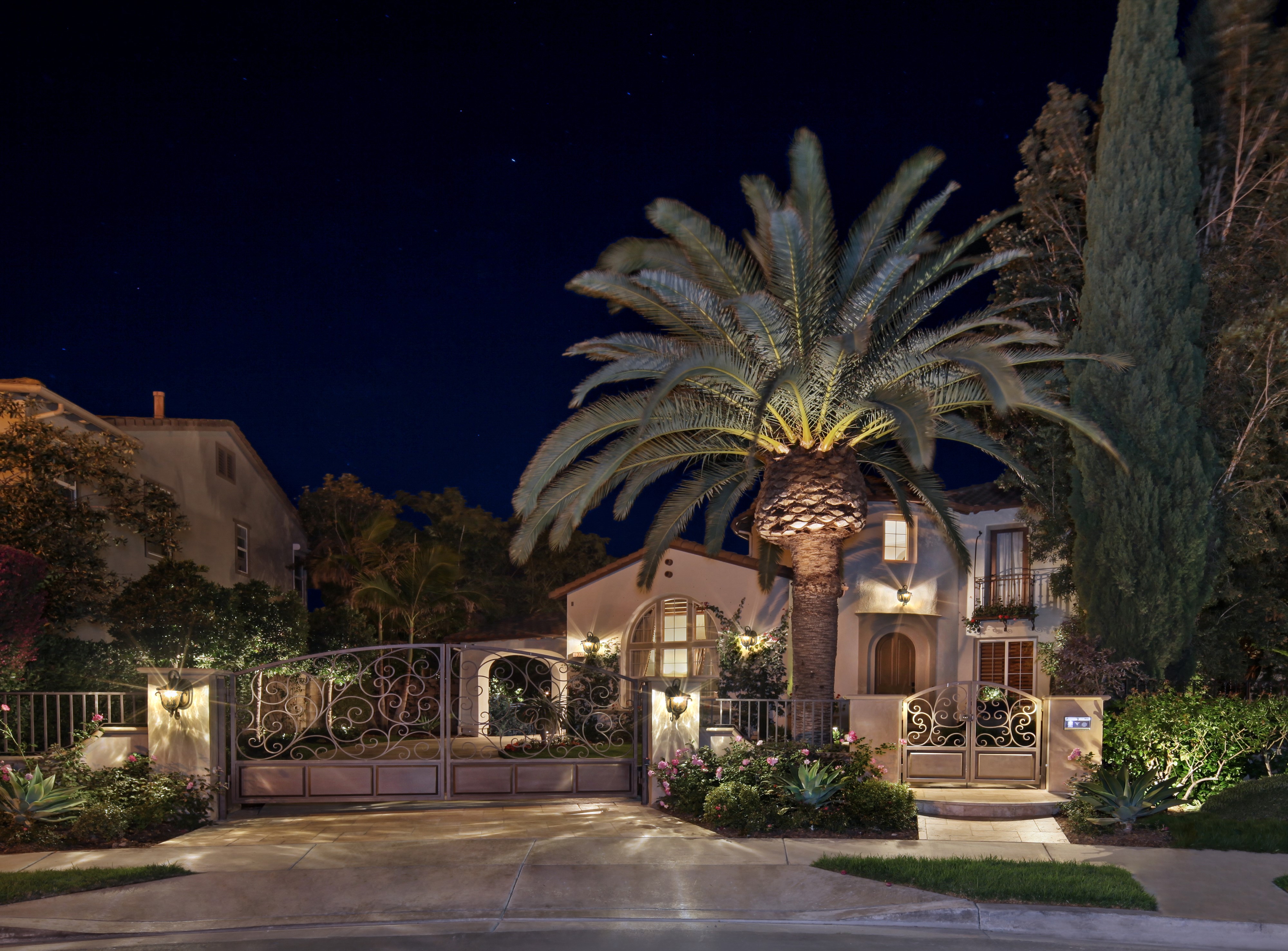 Luxury Mansion with Ornate Gates and Palm Trees at Night in San Clemente, USA HD Wallpaper