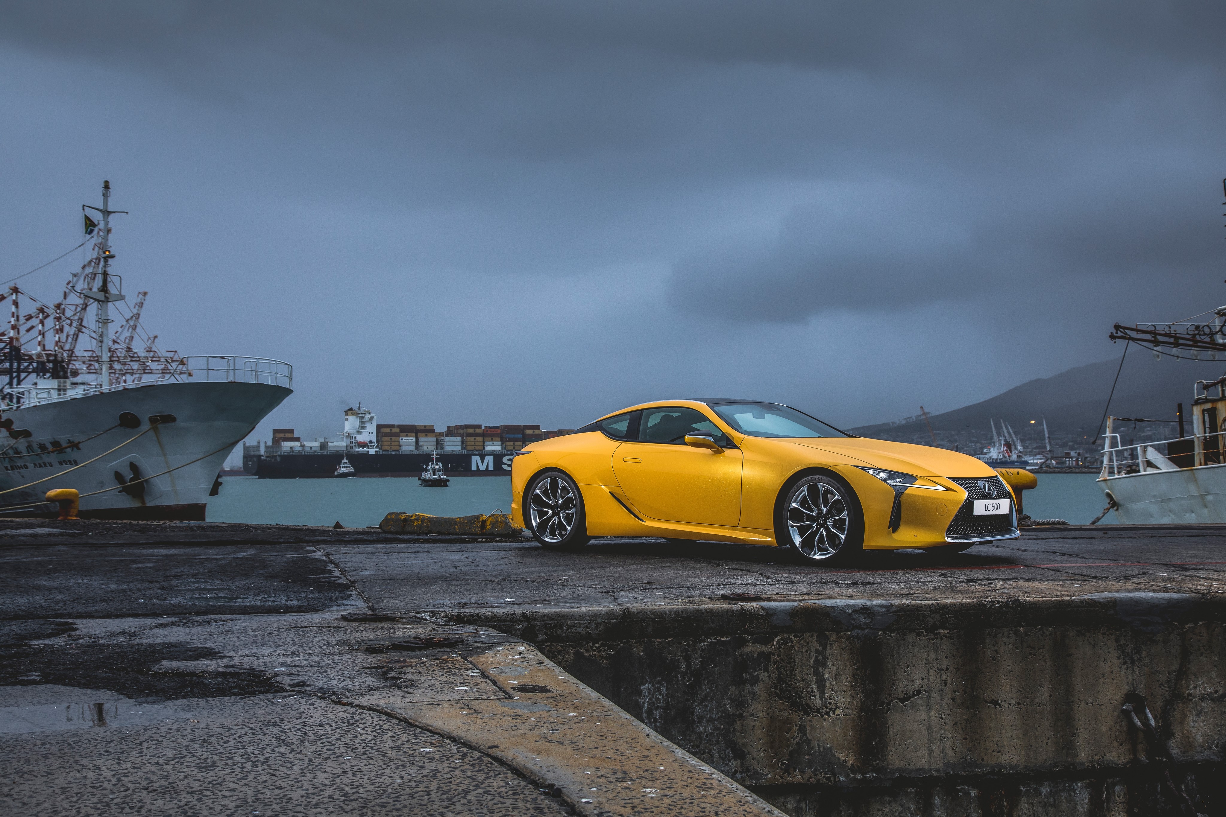 Yellow 2017 Lexus LC 500 at a Harbor HD Wallpaper