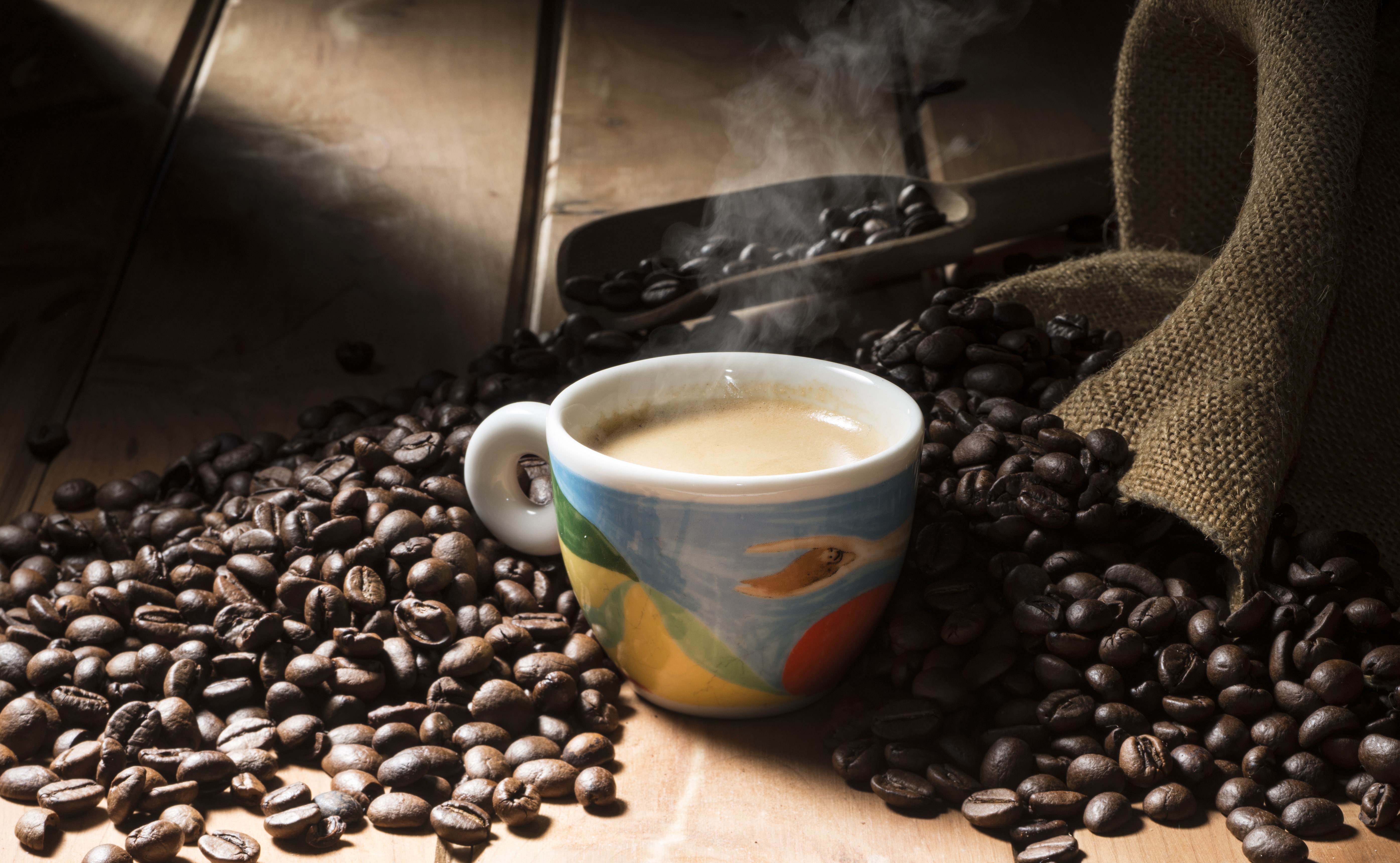 Cup of Coffee with Coffee Beans HD Wallpaper