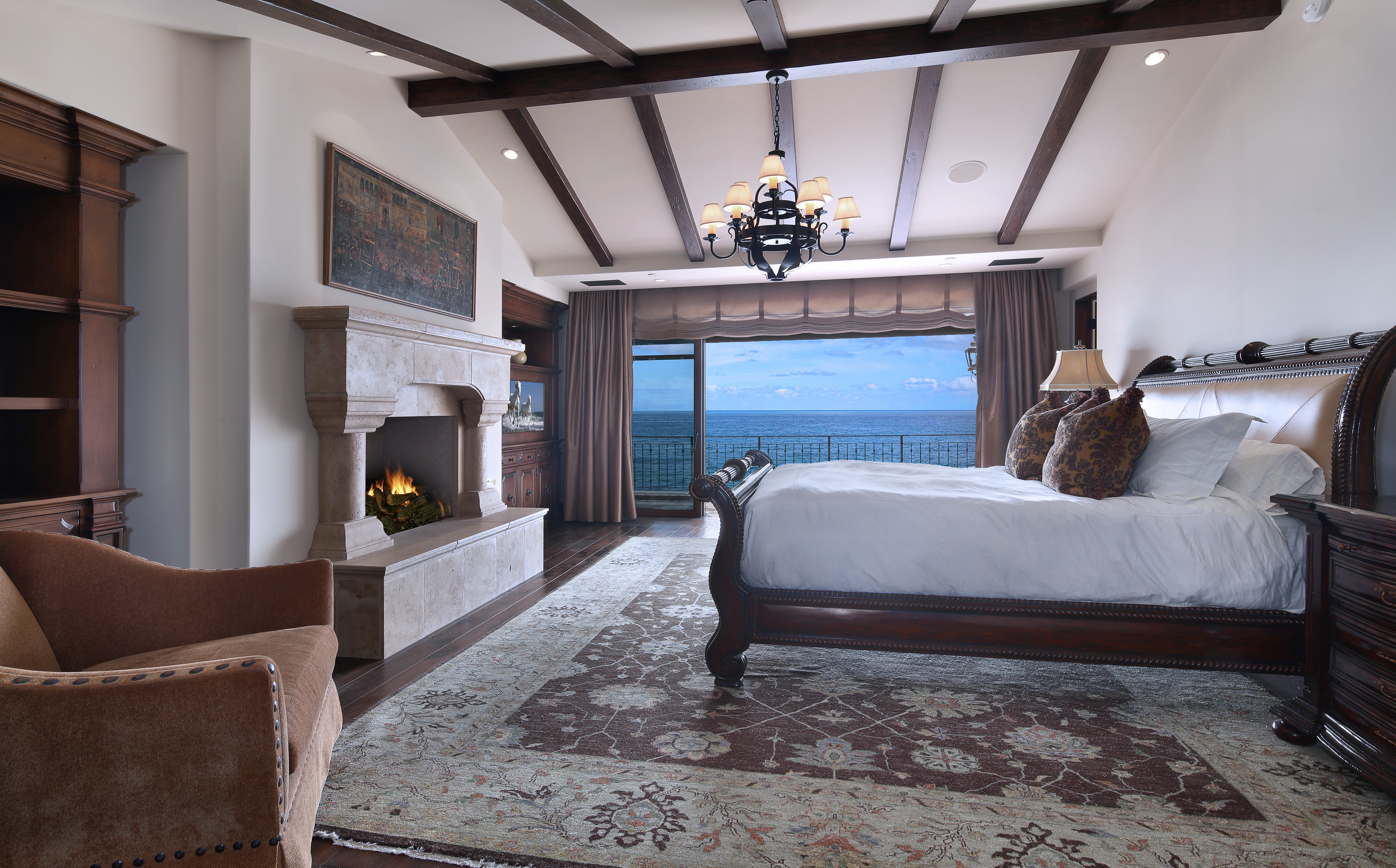 Luxury Bedroom with Ocean View and Fireplace HD Wallpaper